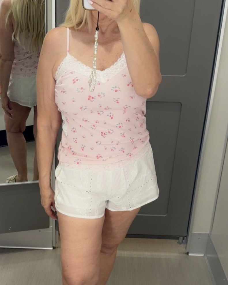 Pink floral tank top paired with white lace eyelet shorts for a cute feminine summer outfit. Lightweight comfortable look perfect for vacations, casual weekends and hot weather days.

#LTKPetite #LTKootd #LTKOver40