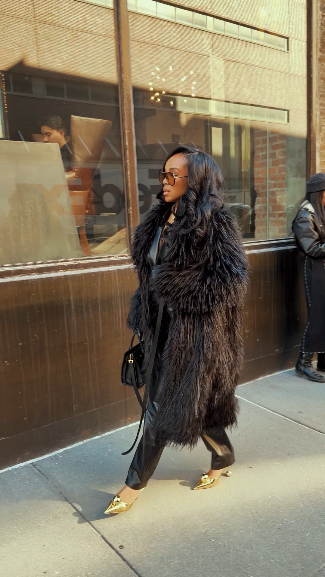 City chic with major main-character energy 🖤 This full monochrome moment layered with a dramatic faux fur statement coat is the definition of elevated street style. The sleek leather base keeps it polished, while the texture from the coat adds depth and dimension. Styled multiple ways, this is the kind of investment layer where the cost per wear keeps dropping every season.

Paired with gold pointed heels for contrast and a structured mini bag for balance, this look feels bold yet timeless. Swap in boots for winter days or heels for date night — it transitions effortlessly.

Perfect for: city dinners, fashion week vibes, rooftop drinks, winter date nights, girls’ night, or holiday events.

Tap to get details and favorite to recreate later.

📏 Sizing:
Wearing size Small  
Height 5’4” · 140 lbs · 36D · 27” waist · 40” hips

This post includes statement coat styling, faux fur coat outfit, monochrome black outfits, leather pants women, winter street style inspiration, date night winter looks, luxury capsule wardrobe pieces, and elevated city outfits styled multiple ways.

Follow me on Instagram and YouTube @kirasfashionfinds
