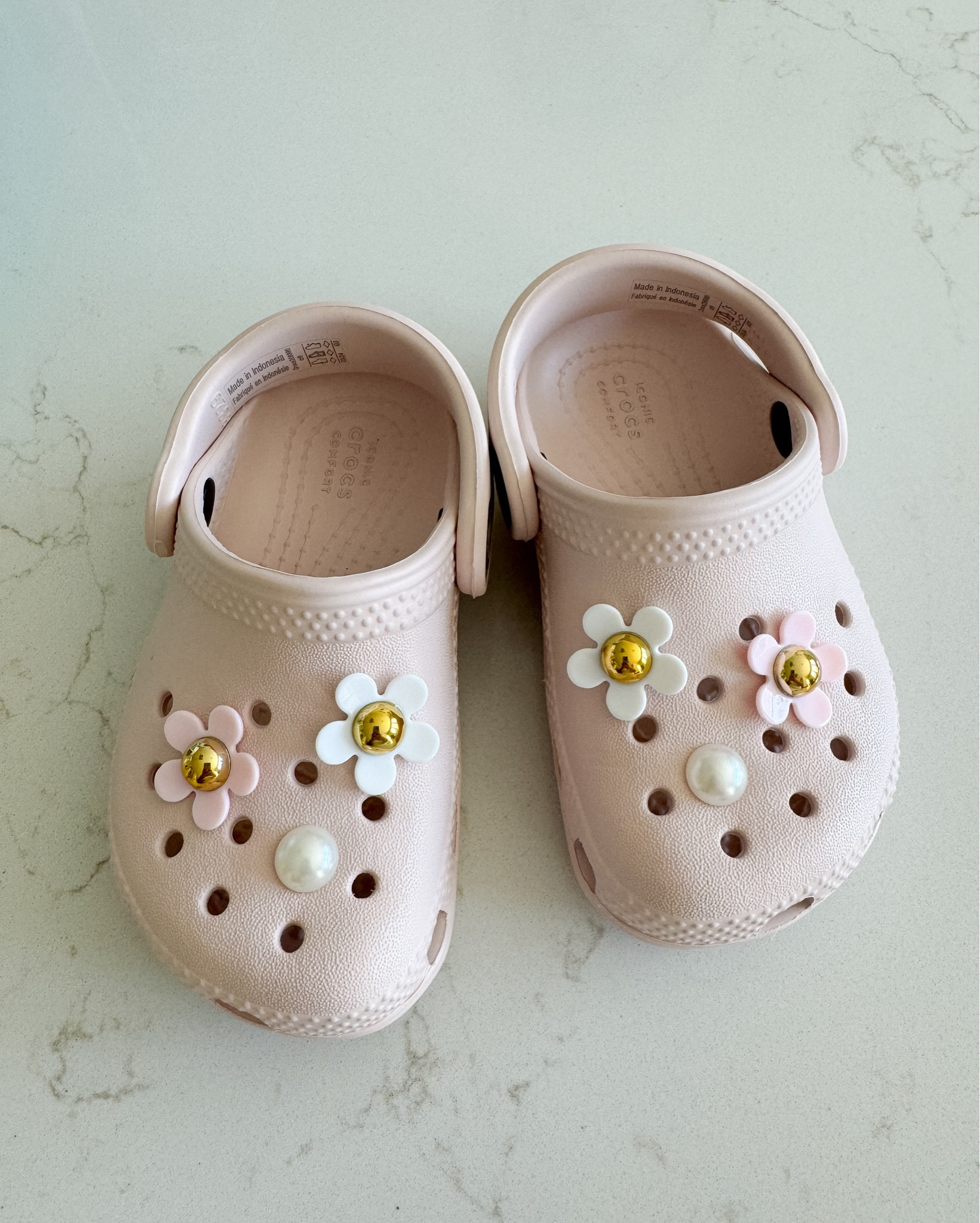 Our baby girl just turned one and will
be walking in no time! We bought her her first pair of crocs. Love how these look with the jibbitz I found on Amazon. So cute!  I couldn't resist buying myself and her grandma a pair to match her 🤣

#LTKFamily #LTKKids #LTKBaby