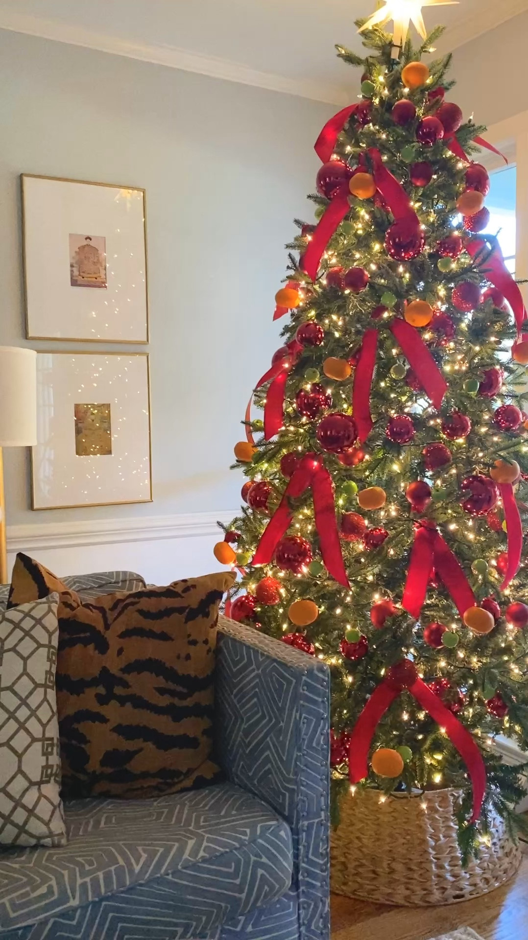 This year’s Christmas tree decorations. I used lots of red ornaments, faux oranges and apples and red velvet ribbon. I also reused our woven tree collar and lighted Moravian star tree topper.

#LTKSeasonal #LTKHoliday #LTKHome