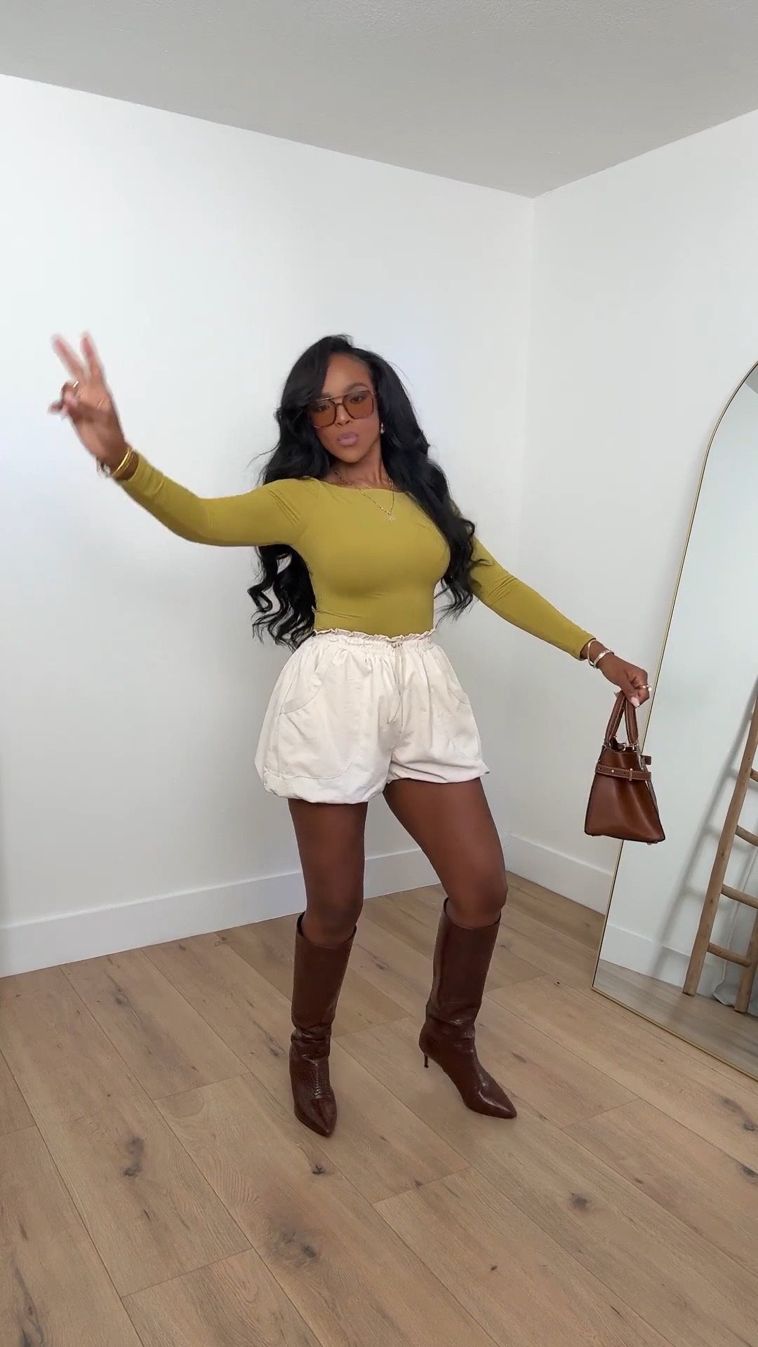 Olive & Cream Contrast 🤎✨ — this fall-forward combo is all about balancing cozy tones with crisp details. Styled with tall brown boots and a structured mini bag for that elevated everyday vibe. Perfect for coffee runs, casual date nights, or chic fall outings.

📏 Sizing: Top (S), Shorts (S), Boots (TTS)

#LTKMostLoved #FallStyleInspo #OOTDinspo


#LTKStyleTip 

