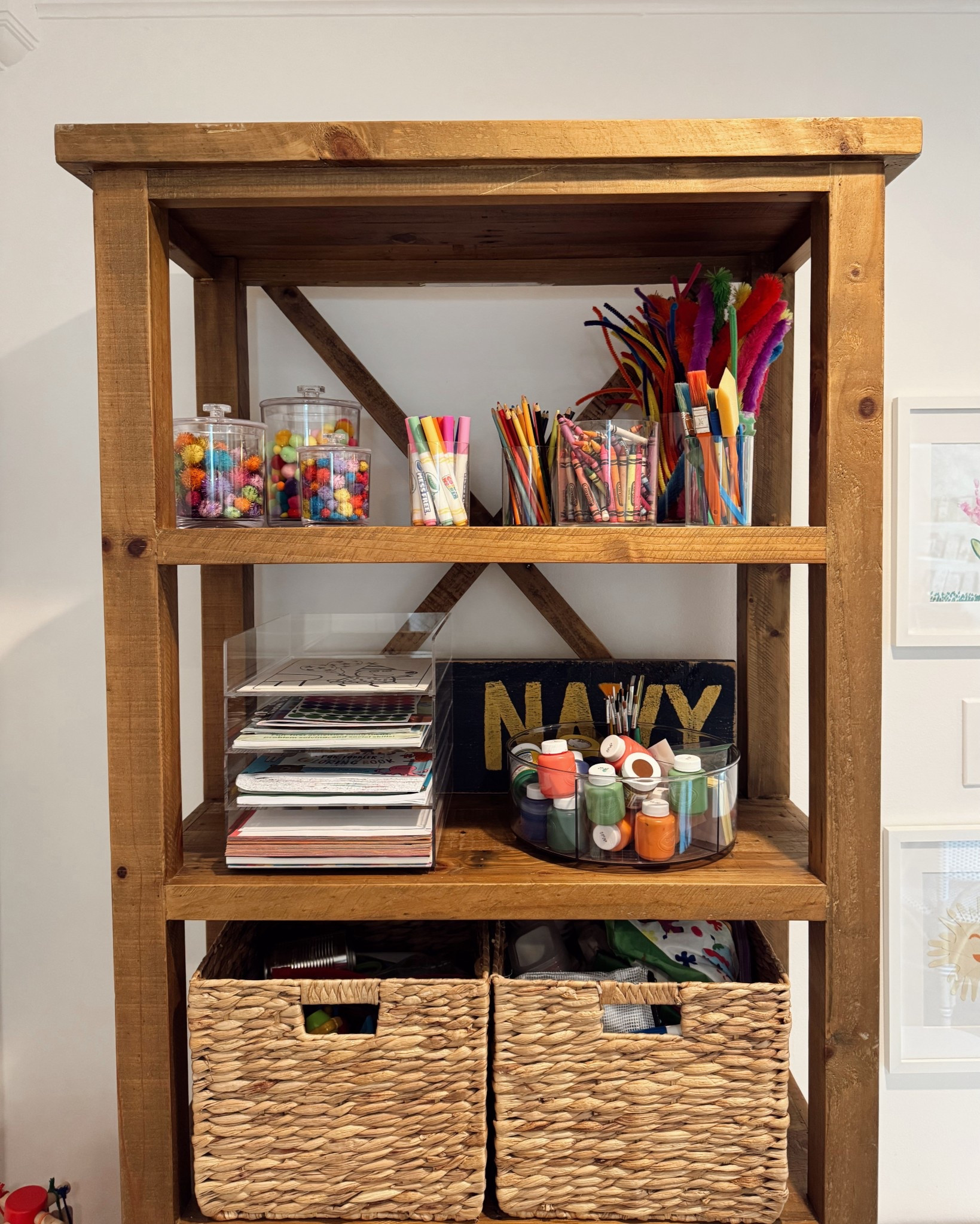 Our little craft corner has quickly become one of the most used spots in the house 🖍️✨ I used woven bins to keep everything accessible but tidy, and added clear jars up top for colorful supplies we reach for all the time. The shelf itself is such a great find for toy or craft storage — linking similar pieces + favorites from this space!

#LTKHome #LTKKids #LTKFamily