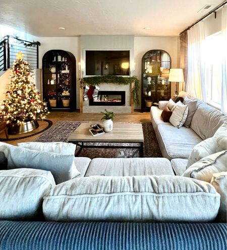 Here are the most frequently requested links from this room for our TikTok followers. 

Living room decor, large neutral sectional, Christmas tree, garland, tripod lamp, arched black cabinet, curio cabinet, Loloi rug, multi-colored rug, christmas train, tree collar, tree topper 


#LTKSeasonal #LTKCyberweek #LTKHoliday