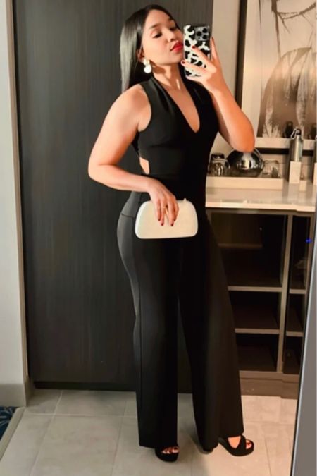 This black jumpsuit is sexy! Perfect wedding guest jumpsuit, dinner outfit, date night outfit, jumpsuit wedding guest outfit.

#LTKunder100