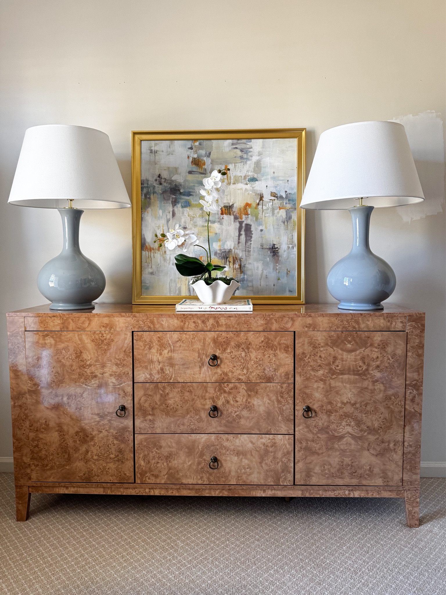 Burl wood side board. Can also be used as a media console or dresser! Assembly required. Might be worth hiring a handy man to help. My husband did it but said it wasn’t fun. That’s the trade off for getting a designer style piece for under $250 👏 worth it! 

#LTKHome