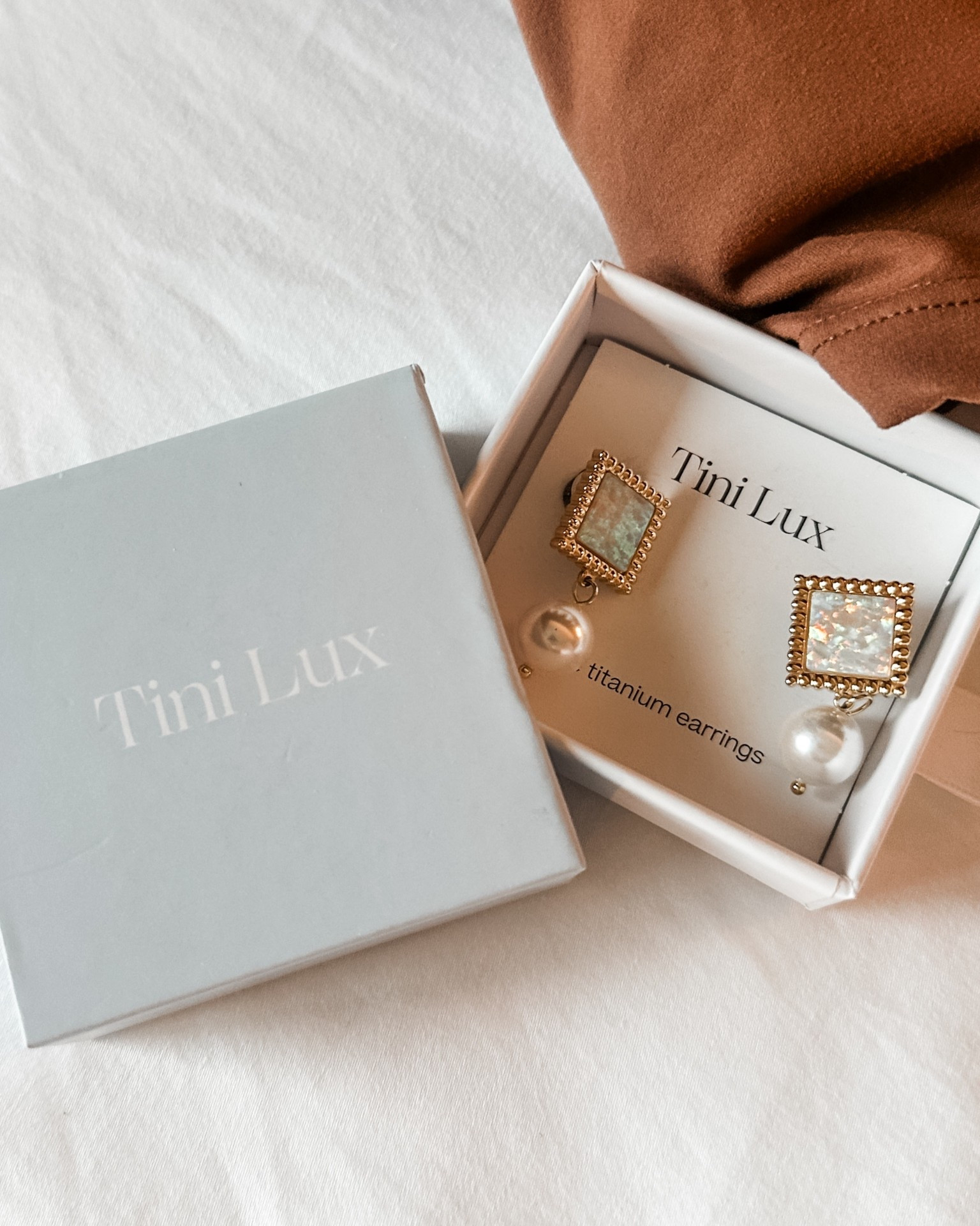 The most GORGEOUS earrings from Tini Lux! The Pearl + the statement piece are stunning and they are titanium, which makes them perfect for sensitive ears!

#LTKBeauty #LTKootd #LTKgrwm
