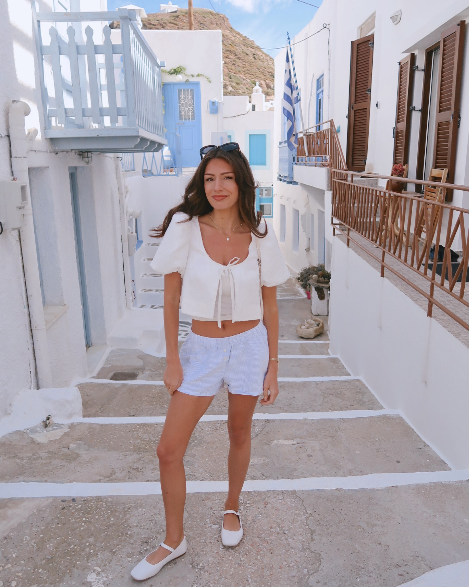 What I wore in the Greek islands // women’s summer outfit, white blouse, blue pinstriped boxer shorts (Brandy Melville), white leather ballet flats

#LTKBeauty #LTKShoeCrush #LTKStyleTip