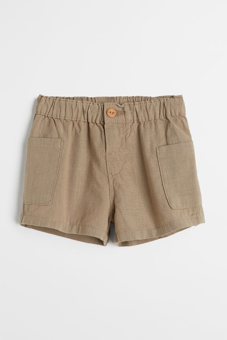 Shorts in airy, woven cotton fabric. Adjustable, elasticized waistband, mock fly with button, and... | H&M (US + CA)
