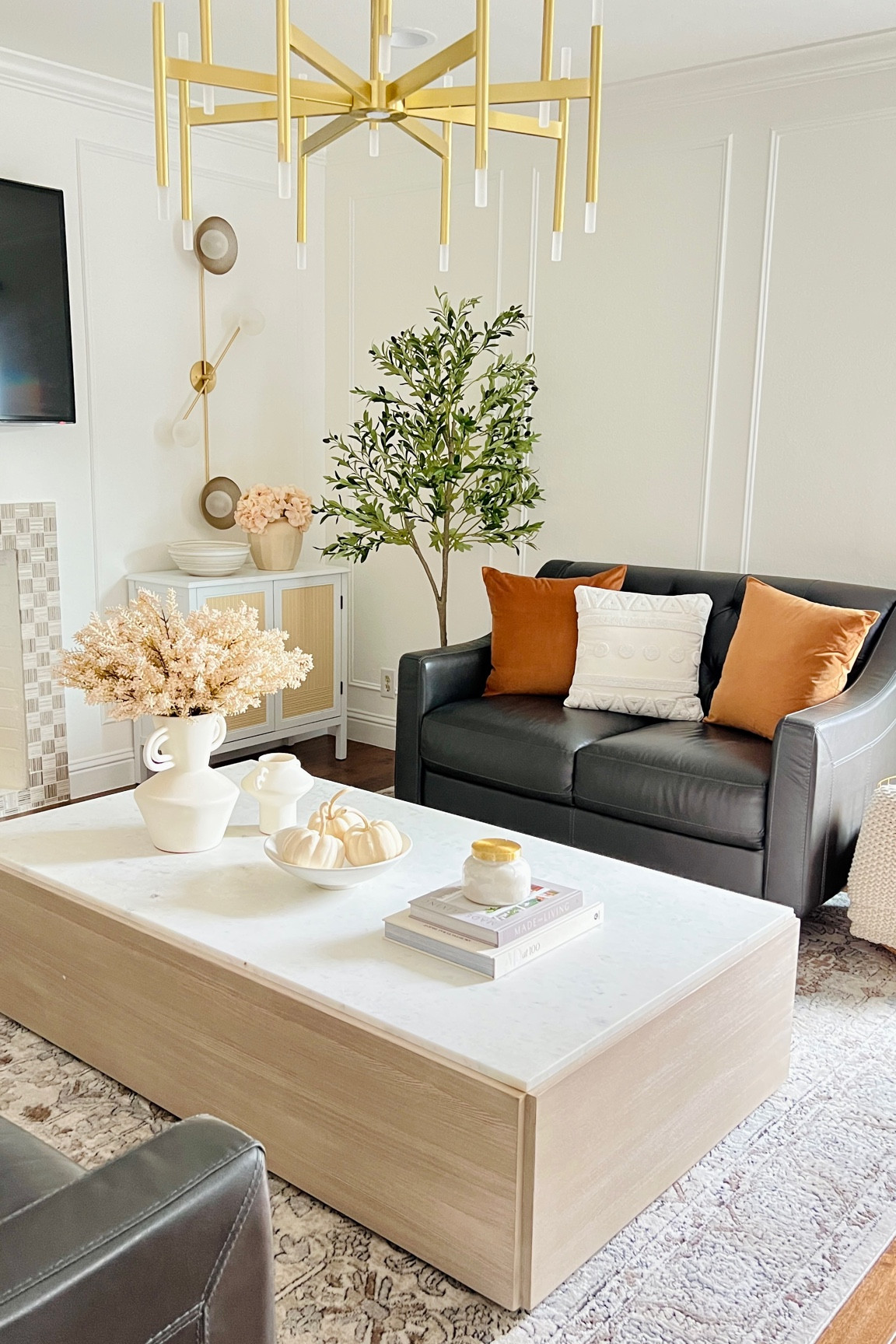 Fall family room decor
Warm brown pillows, white pillow covers, artificial berries , chunky knit blanket, cream throw, artificial olive tree, fall florals, speckled bowl, decorative bowls, decorative vase, handled vase, terracotta vase, ceramic vase, stoneware bowl, neutral area rug, beige rug, loloi rugs, large coffee table, stoneware vase, neutral fall decor, Capri blue volcano candle, Anthropologie candle, Crate and Barrel marble coffee table 

#LTKsalealert #LTKhome #LTKSeasonal
