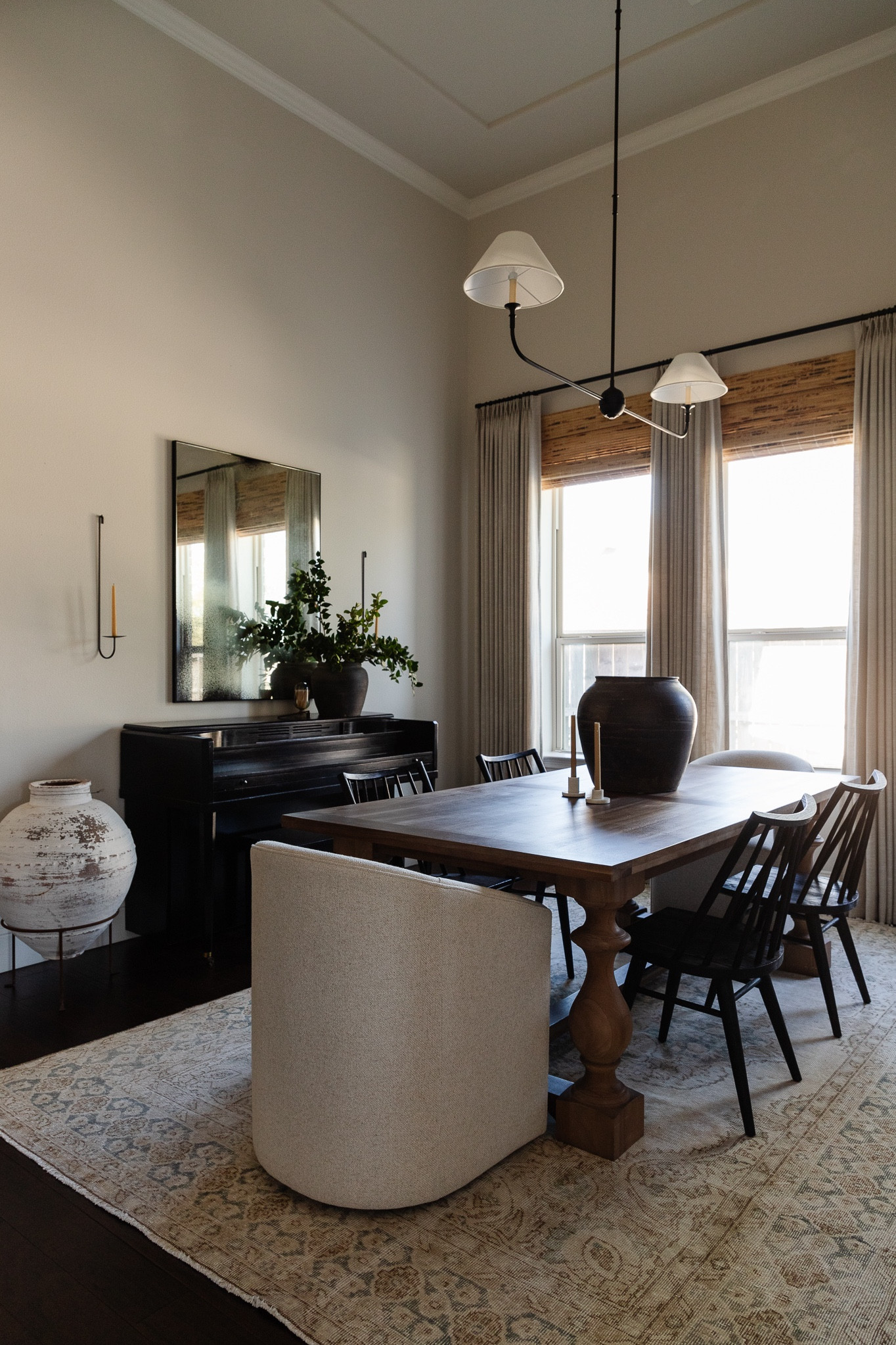 Our dining room makeover with new barrel back boucle dining chairs, vintage rug, linear chandelier, vintage pottery, and pinch pleat drapes



#LTKhome