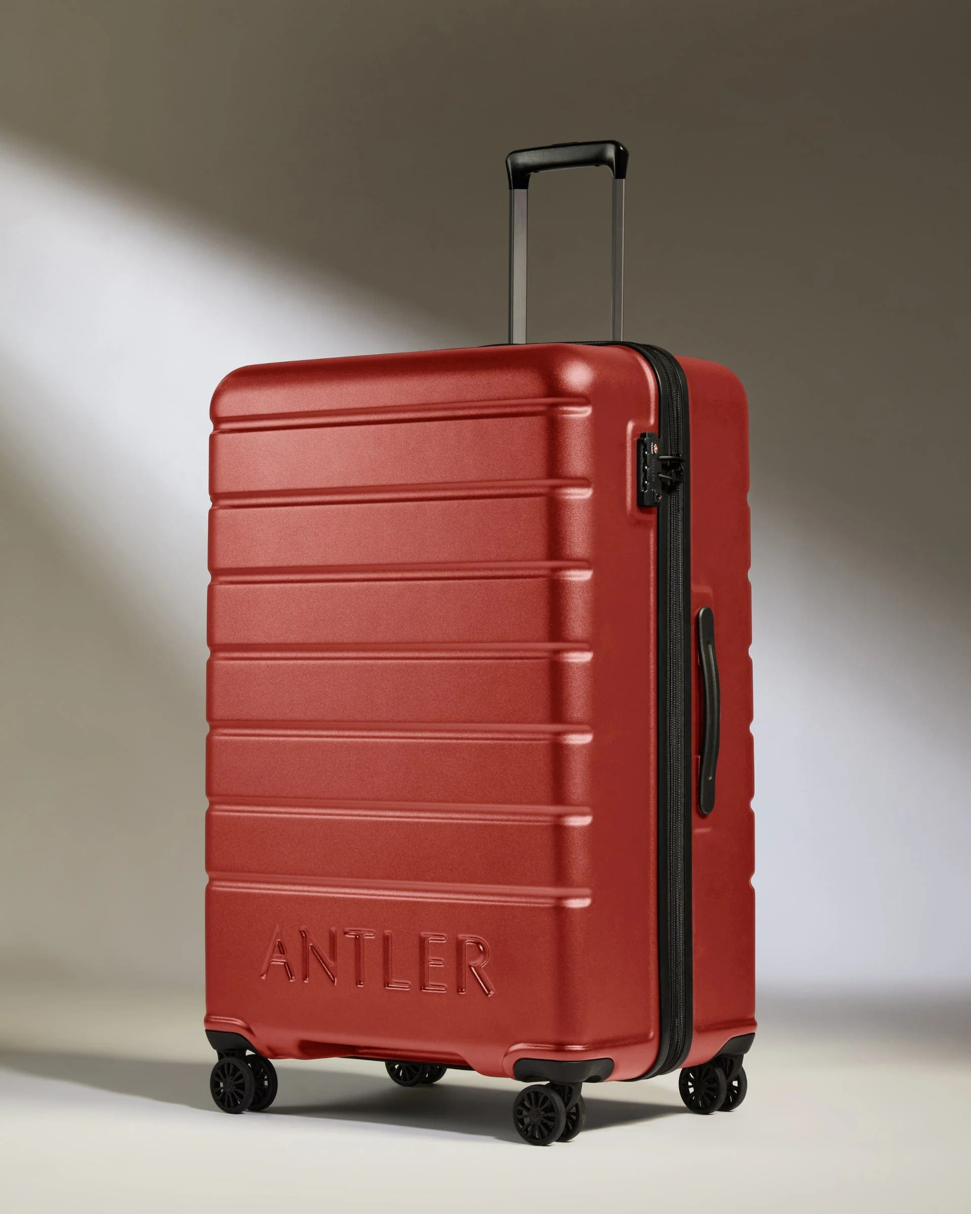 Large Suitcase Red Orange - Logo | Lightweight Hard Shell Luggage | Antler UK