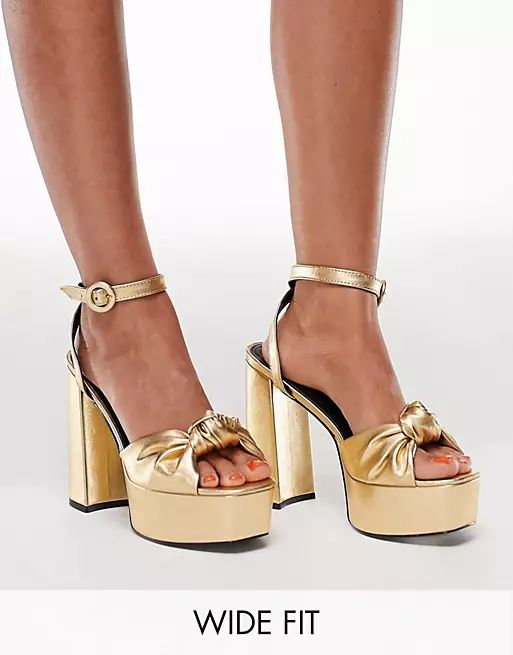 ASOS DESIGN Wide Fit Note knotted platform heeled sandals in gold | ASOS (Global)