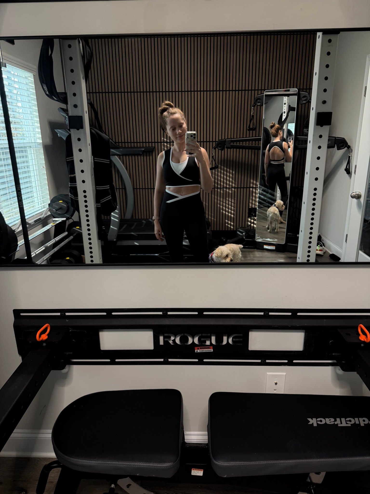 Black workout set with a wrap sports bra and open back workout top. I love the fun wrap detail on this top, and you can see the open back design in the mirror. It’s such a flattering twist on a classic black activewear look.

This set is great for pilates, strength training, barre workouts, or everyday athleisure. The fabric is soft, supportive, and moves really well during workouts.

For reference I am 5’2 wearing size XS.

#LTKfitnessgoals #LTKmomlife #LTKdayinmylife