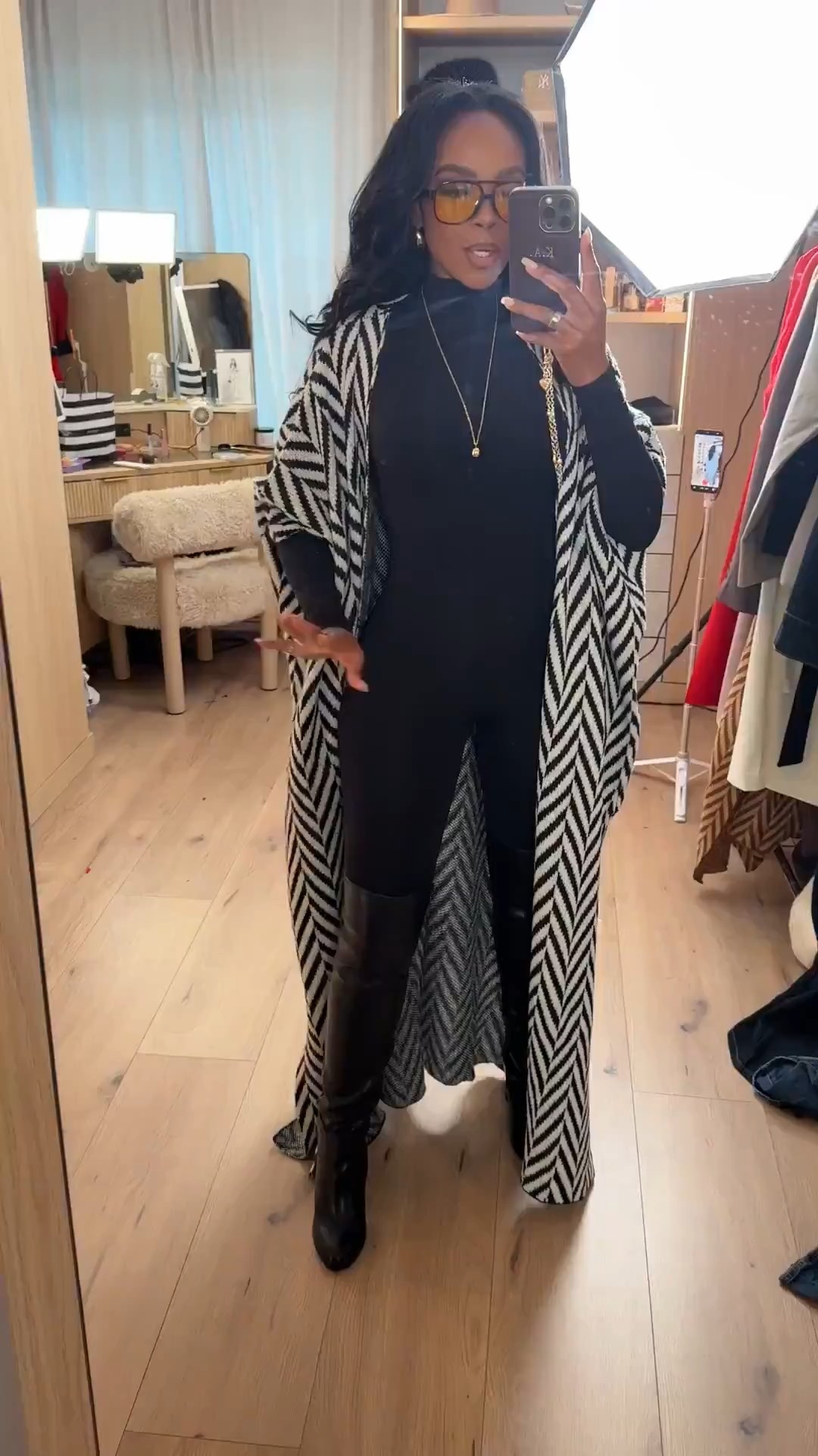 Polished layers with an edge — this is how I’m styling a fitted black base when I want warmth, shape, and contrast without overthinking it. The long patterned layer adds movement while the black underneath keeps everything grounded and wearable.

Perfect for coffee runs, casual meetings, travel days, or a chic everyday look.

Tap to get details and recreate this outfit.

📏 Sizing & fit details:  
Wearing size Small  
Height: 5’4”  
Bust: 34D  
Waist: 27”  
Hips: 40”  
Jeans and pants fit reference: 27 Long / 4 Long  

This look works because the fitted base balances the dramatic outer layer, making it easy to style with boots now and lighter shoes later. Pieces like this are great building blocks you can rewear all season, styled multiple ways so the cost per wear keeps dropping.

Neutral layered outfit ideas, black base outfit styling, winter layering inspiration, everyday chic outfits, versatile capsule wardrobe pieces, long coat styling, wide-leg pant alternatives, modern casual looks.

Follow me on Instagram and YouTube @kirasfashionfinds 

#LTKPetite #LTKootd