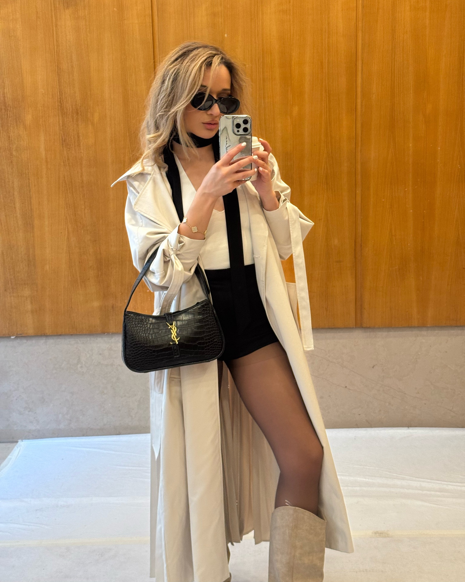 Chic Parisian inspired outfit. I love me a combination of a big cream coat, white top, hot pants and knee high boots.

#LTKootd #LTKgrwm #LTKPetite