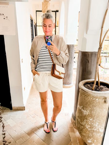 Ootd - Sunday. Ready for a Hammam treatment. Wearing terry cloth shorts, a striped top, satin bomber and Ipanema sandals. Mango bag is an exact Celine Triomph lookalike. 

Bomber Je m’appelle (40)
Top Norah (40)
Shorts HEMA (M)



#LTKswimwear #LTKnederlands #LTKeurope