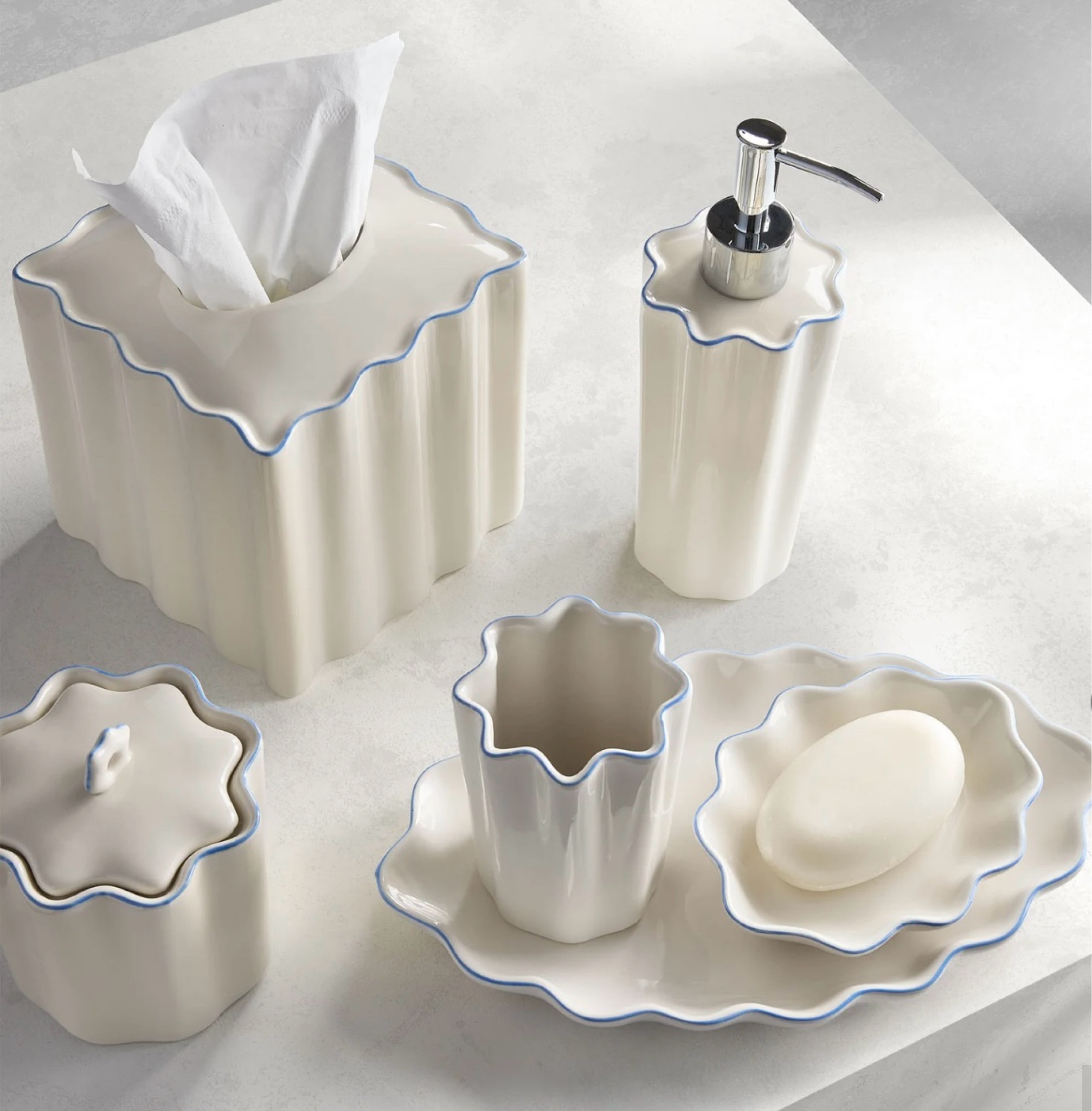 Pretty bath accessories with scallop details and blue trim - powder room bath decor - guest room bath decor

#LTKhome #LTKstyletip