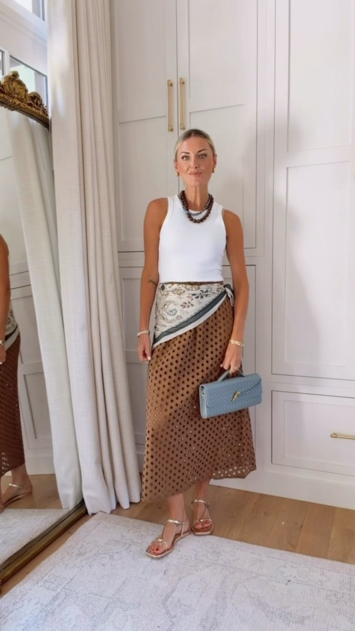 I have this skirt already in a couple colors! Loved this brown for fall, and this scarf goes perfectly with it! I would add a jacket over this for some extra warmth! Wearing S! 

Loverly Grey, Amazon, early fall outfit, fall looks, brown skirt, white ribbed tank, scarf styling

#LTKootd #LTKSeasonal