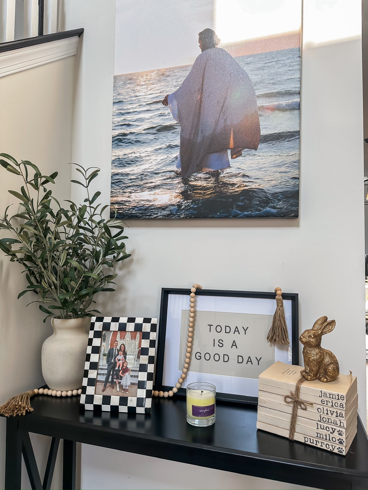Black entryway console table + decor

Faux olive plant // today is a good day artwork // black and white checkered picture frame // custom name book stack // Etsy home decor finds // Mackenzie Childs home decor 

#LTKFamily #LTKHome