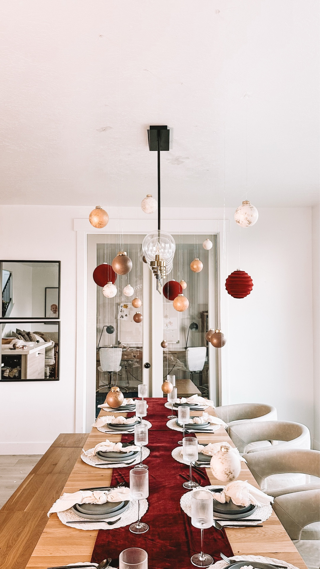 Holiday table decor without a centerpiece ✨ I hung lightweight ornaments from the ceiling using fishing wire + sticky dots so the table stays open and functional—perfect for hosting. This would be stunning with flowers in the spring, too.

#LTKHoliday
