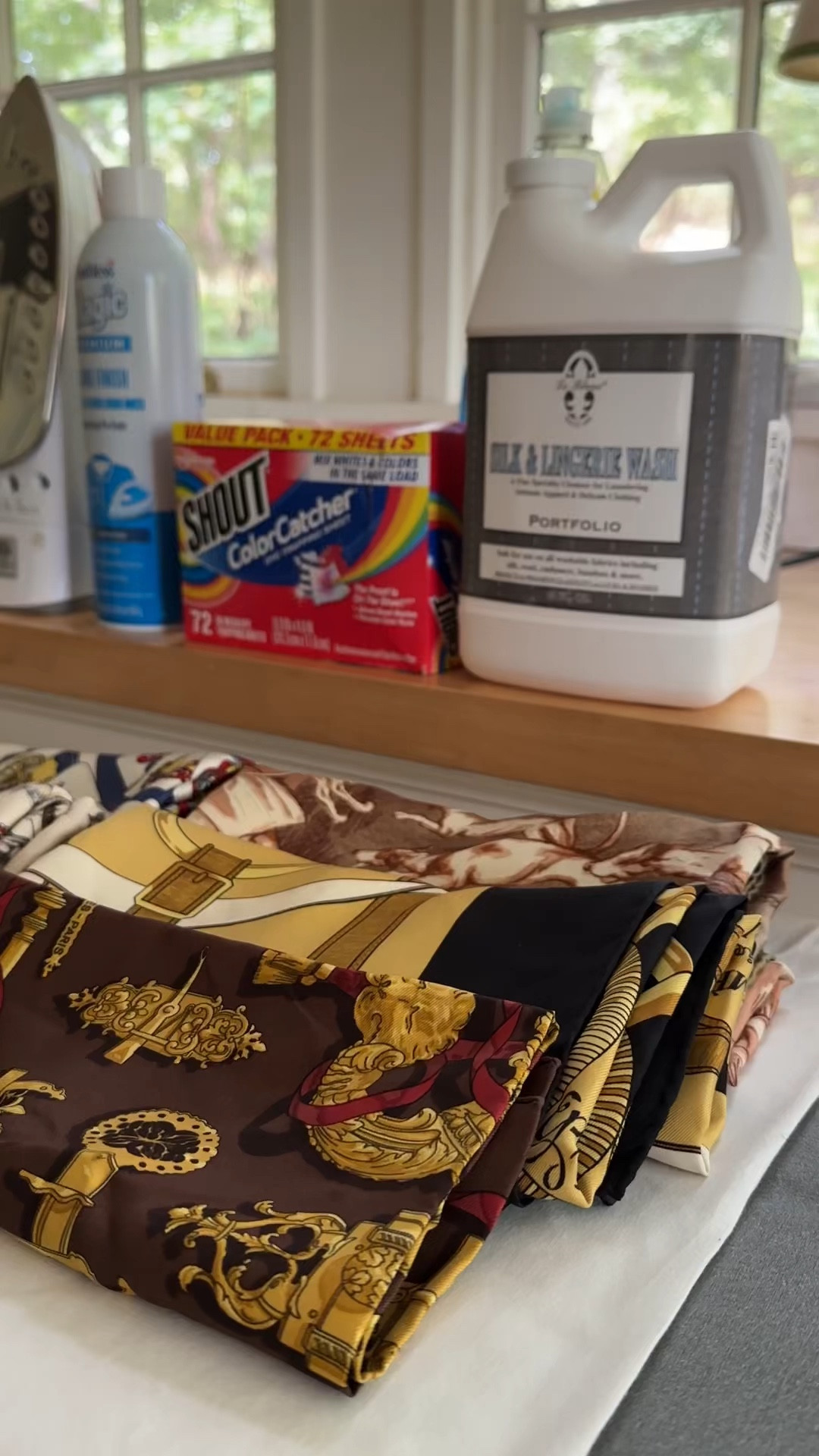 How I wash an Hermès scarf at home in just a few easy steps. The hardest part is being brave enough to do it, but it truly works like a charm. I wash my own scarves this way and I'm washing a few for my new little "As Seen in" scarf boutique (coming soon). Here are all the things you'll need- 1. Le Blanc Silk and Lingerie wash (this is my preferred detergent). It's gentle on silk, but works very well. 2. Dawn Dish Soap for stains that may be grease based. 3. Shout Color Catcher Sheets to stop any potential running of dye. 4.
Rubber gloves if you don't want your hands in detergent 5.
Bins for handwashing and rinsing 6. Magic Sizing Fabric Finish. This is what makes your scarf stiff and starched (I don't like a lot, but a little is helpful). 7. A towel for drying 8. A drying rack also for drying 9. And an iron. It sounds like a lot, but some of these things you may already and most are not too expensive. Let me know in the comments if you have any other washing questions! Can't wait for you to see the "As Seen In" store. #hermes #hermesscarf #scarftutorial #silkscarf #washascarf #vintagescarf 