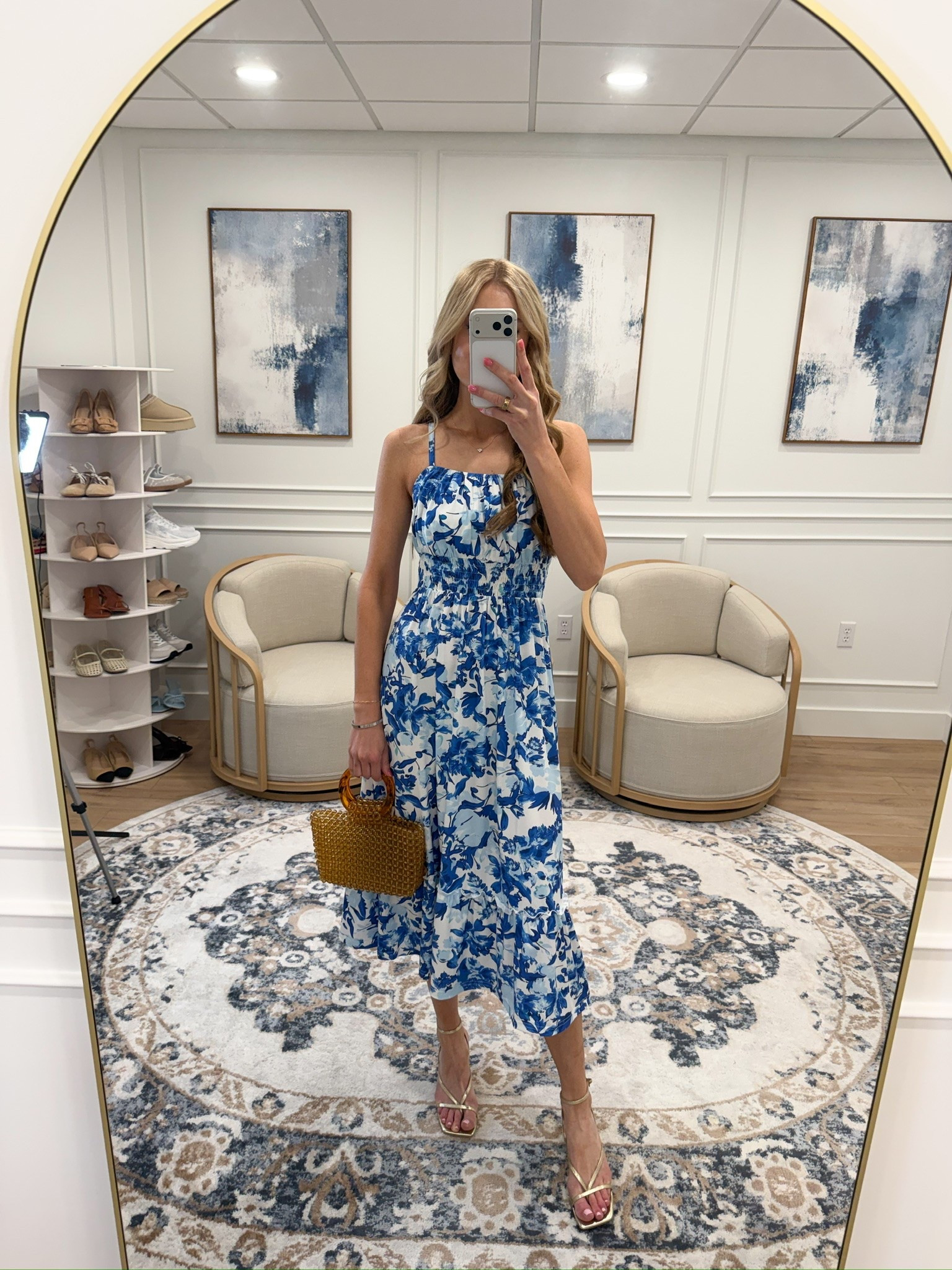 The blue and white floral midi dress that looks like it came straight off a resort rack — and it’s an Amazon find 🩵🤍✨ Bold blue floral print on white, smocked bodice, spaghetti straps, and a flowing midi skirt that moves so beautifully. Styled with gold strappy heeled sandals and a beaded rattan bag with tortoise handle — elegant, feminine, and completely summer-ready.

#LTKMothersDay #LTKWedding #LTKSeasonal