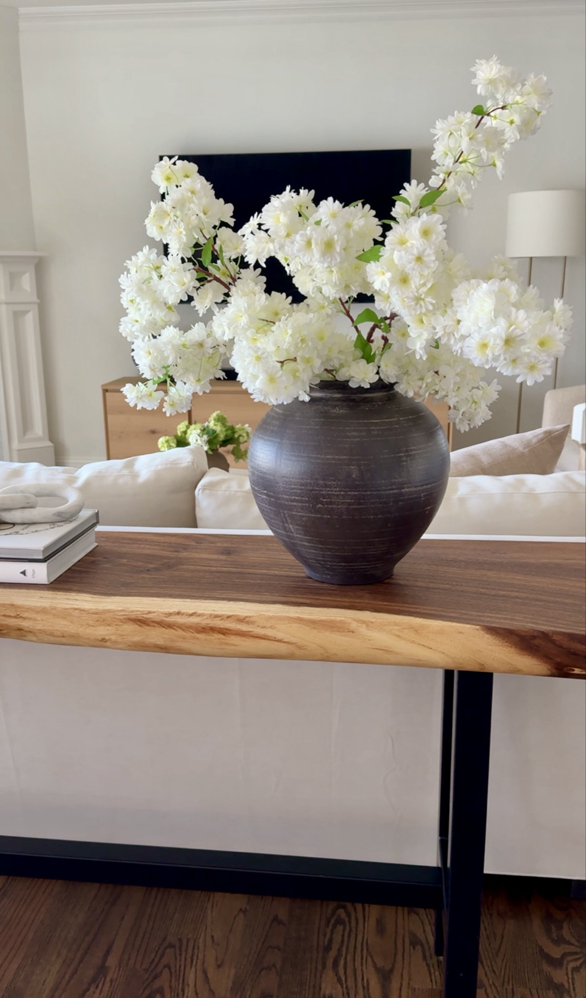 Spring faux florals styled in oversized neutral vases. These stems have natural movement and elevate a space instantly — especially layered in textured ceramic.

#Florals
#Vase
#HomeDecor
#LivingRoom
#ConsoleTable


#LTKHome #LTKSaleAlert #LTKOver40