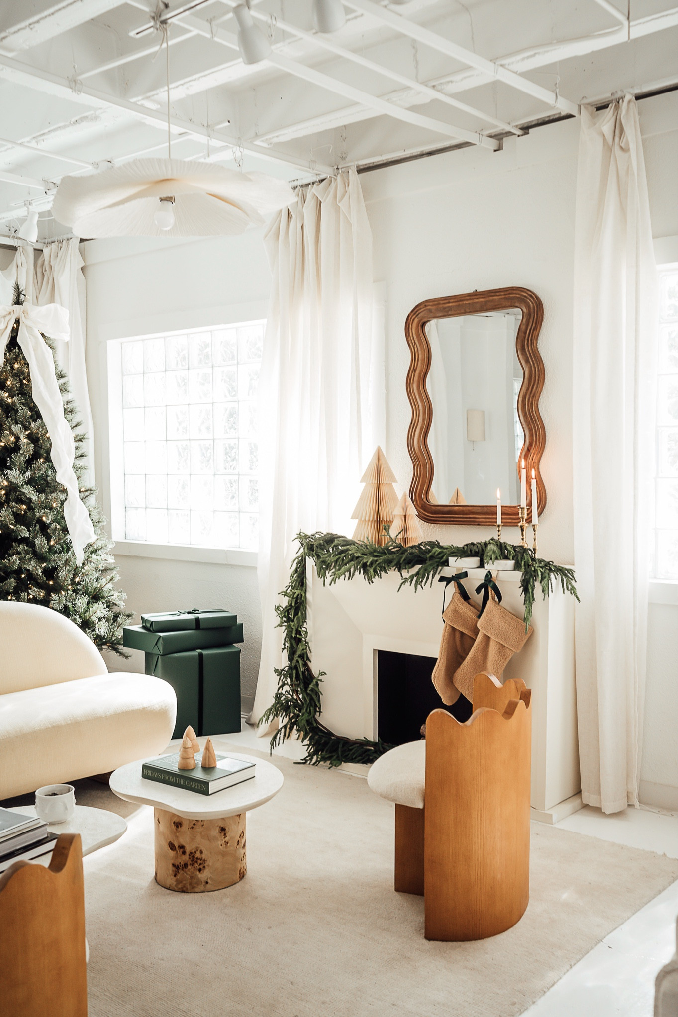 Living room Christmas decor: faux garland, mirror, chairs, sofa, Christmas treee

#LTKStyleTip #LTKHoliday