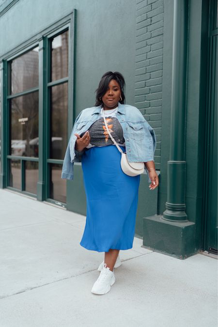 Plus size casual outfit idea! 

Satin slip skirt. Plus size graphic tee. Men’s graphic tee. Cropped denim jacket. Madden NYC sneakers. 

#LTKplussize #LTKfindsunder50 #LTKfamily