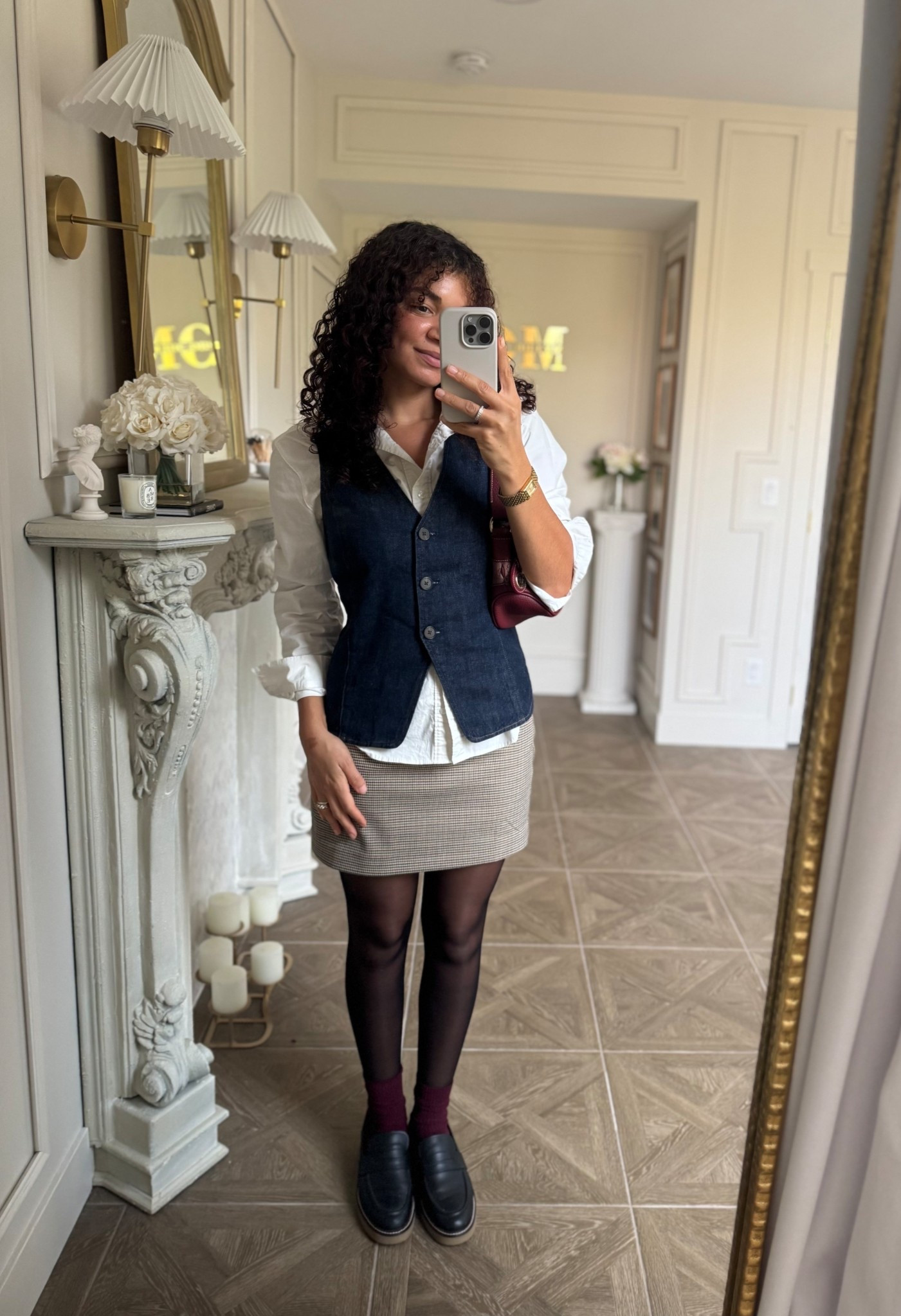 Layered fall outfit: white button up, denim vest, houndstooth mini skirt, sheer tights, burgundy socks, loafers 

#LTKSeasonal #LTKStyleTip