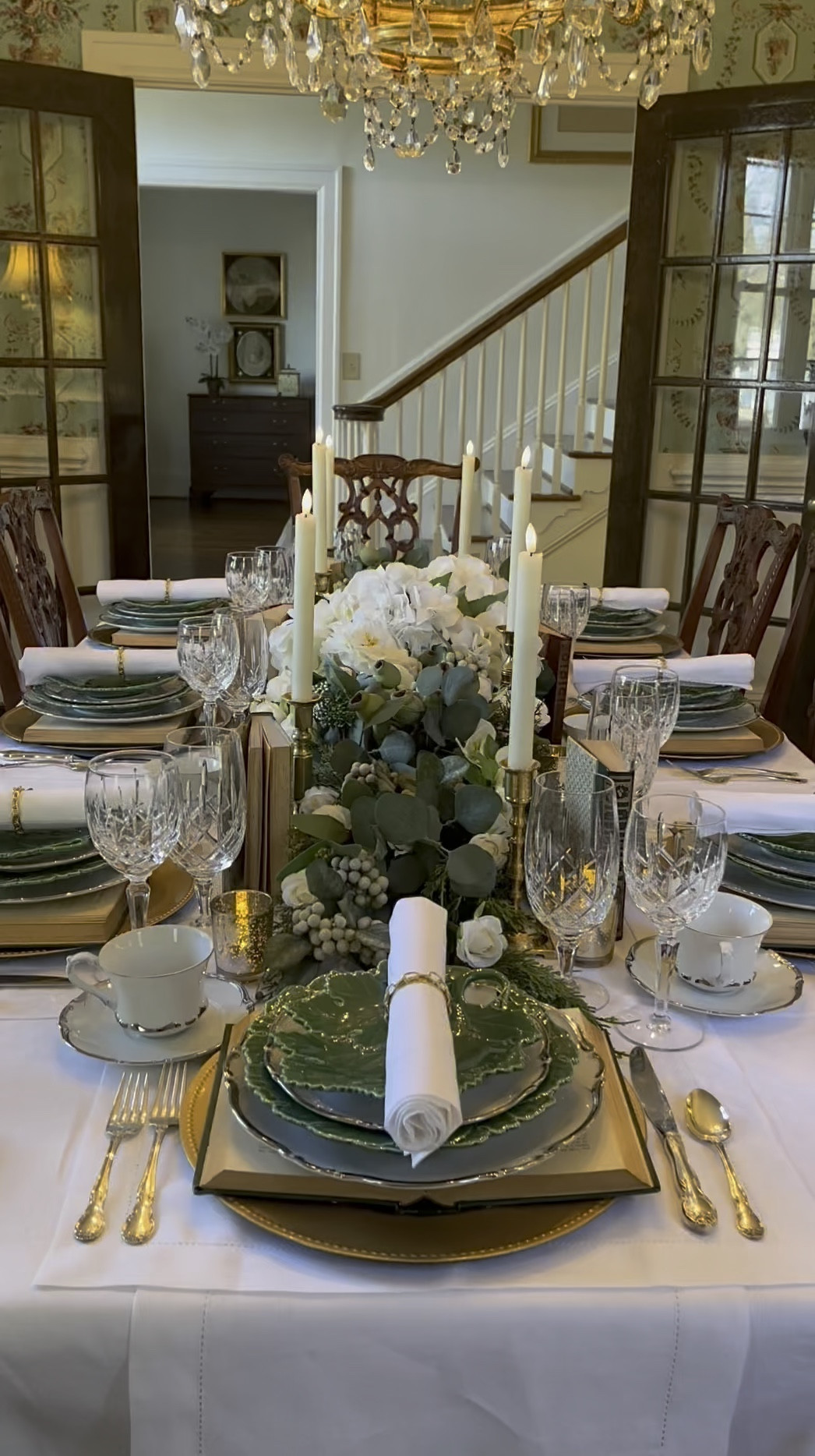 Book lovers, gather 'round! 📚✨ I'm thrilled to share my book club tablescape again for those who enjoy reels. Imagine each place setting as a new chapter in your favorite novel—what book would you choose as your charger plate? Let me know your top picks below; I’m always on the lookout for fresh inspiration! This setup was all about layering literary charm with every dish stack resembling our beloved book piles. Who needs a centerpiece when your table itself tells a story? 📚🕯️

Do you host gatherings where the conversations are as rich and satisfying as the meals? Share the books that sparked lively debates or brought out laughter and tears. Let's exchange recommendations and dream up more magical evenings around our tables. As winter lingers outside, remember that warmth is just a candlelit dinner away—with comfort food, cherished stories, and great company to keep us cozy. Here’s to enchanting nights filled with storytelling vibes! 📖🍷