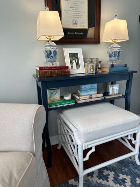 Navy console table in our home office perfect for books, frames, and other small items along with our blue and white chinoiserie lamps! We have a faux bamboo ottoman underneath it which makes our ikea chair even more comfortable. The console table is from Amazon and comes in a white version with a bottom shelf too!

Home office, office decor, faux bamboo ottoman, ikea chair, blue and white rug, dash and Albert, Annie sells, chinoiserie lamps, blue and white lamps, Bud vase



#LTKhome #LTKfindsunder100
