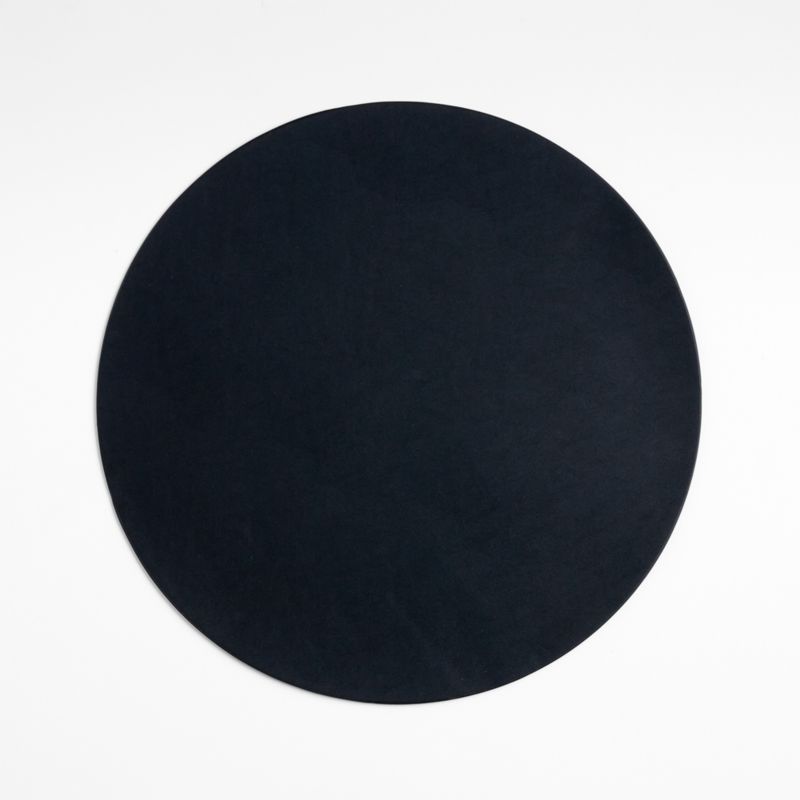 Rizzo Round Reversible Black and White Faux Leather Placemat + Reviews | Crate & Barrel | Crate & Barrel