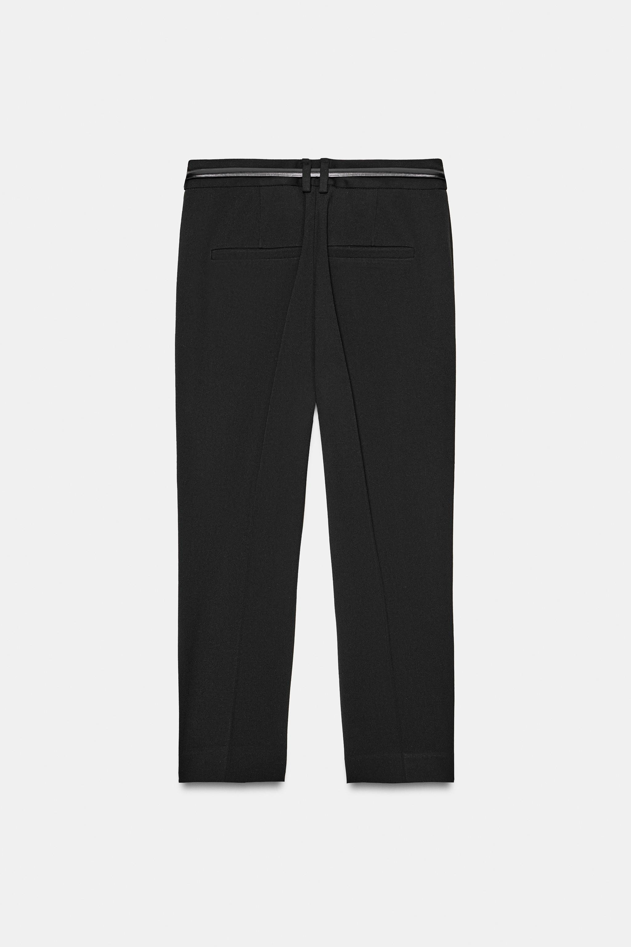 Model height: 178 cmMid-waist trousers with belt. Featuring false welt pockets at the back, cropp... | Zara UK