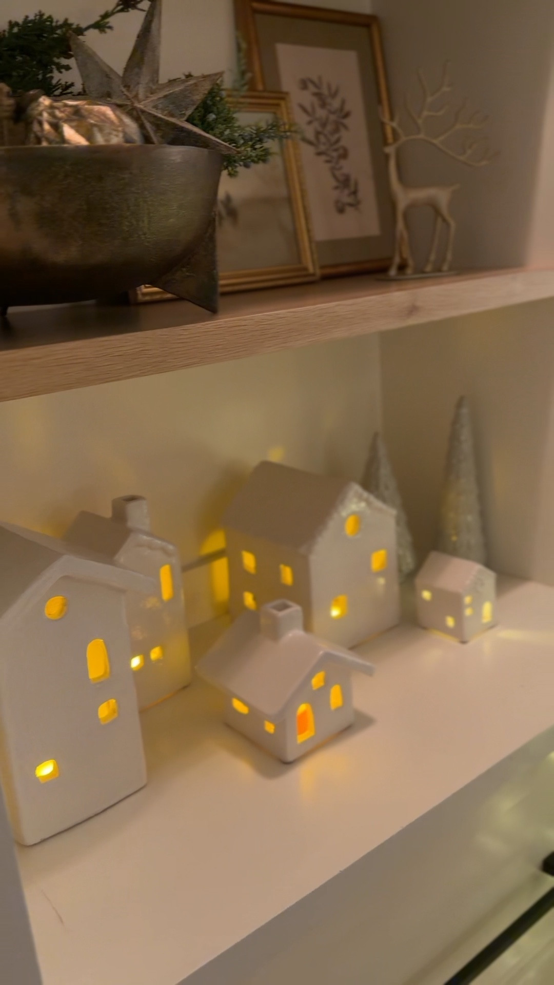 These holiday houses are one of my favorites for our built-in 

holiday decor, Christmas decor, winter decor, garland, lit garland, cedar garland, pine garland, juniper garland, thick garland, realistic garland, mantle garland, staircase garland, holiday greenery, Christmas greenery, faux greenery, wreaths, lit wreath, oversized wreath, classic wreath, holiday foliage, stems, juniper stems, cedar stems, holiday florals, magnolia leaves, holiday branches, evergreen branches, gold bells, rustic bells, bronze bells, decorative bells, holiday candlelight, taper candles, pillar candles, flameless candles, LED candles, glass candle holders, cut glass candles, gold candle holders, holiday glow, tablescape decor, Christmas tablescape, holiday centerpiece, winter centerpiece, coffee table decor, console styling, shelf styling, entryway decor, Christmas tree decor, ornament sets, gold ornaments, brown ornaments, metallic ornaments, ribbon, velvet ribbon, silk ribbon, tree ribbon, holiday stockings, knit stockings, designer stockings, stocking holders, Christmas accents, festive accents, cozy holiday home, organic modern holiday, Mediterranean holiday decor, Pottery Barn holiday, McGee & Co holiday, Anthropologie inspired, Amazon holiday finds, neutral holiday decor, warm holiday tones, winter whites, earthy neutrals, gold accents, bronze accents, seasonal sparkle, cozy textures, faux fur throws, knit throws, holiday pillows, winter pillow covers, twinkle lights, LED twinkle trees, lit birch trees, holiday lanterns, glass cloches, decorative trays, gold trays, marble trays, coffee table styling, mantle styling, entryway styling, festive home ideas, Christmas decorating ideas, elevated holiday home, budget-friendly holiday decor, luxury holiday look, designer-inspired decor, reindeer decor, holiday sculptures, wooden nutcrackers, rustic Christmas, modern Christmas, timeless holiday style, winter hosting, holiday hosting essentials, entertaining decor, festive home inspiration, elegant holiday vibes

#LTKSeasonal #LTKHoliday #LTKHome