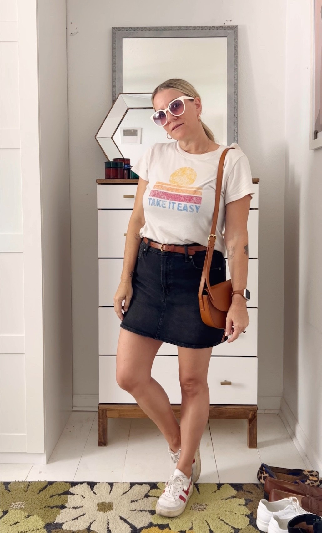 Black denim skirt, a vintage inspired t-shirt and trainers, your Saturday outfit, sorted. Add some brown accessories to soften the black denim. 

#LTKstyletip #LTKSeasonal