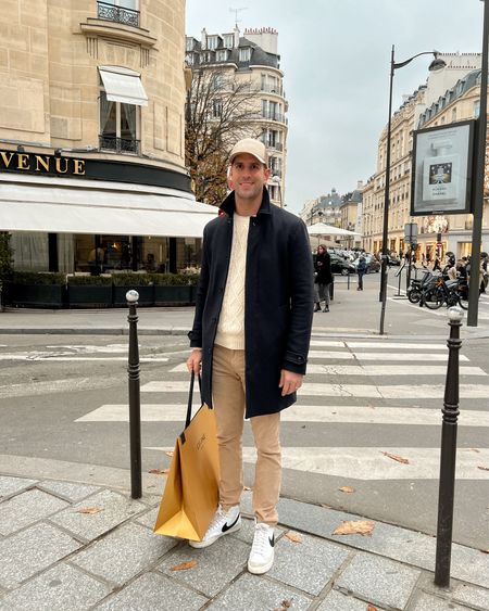 Kat Jamieson of With Love From Kat shares her husband's outfit. Navy wool coat, cable knit sweater, corduroy pants, Nike sneakers, Paris style, men's fashion, men's style.

#LTKmens #LTKshoecrush #LTKstyletip