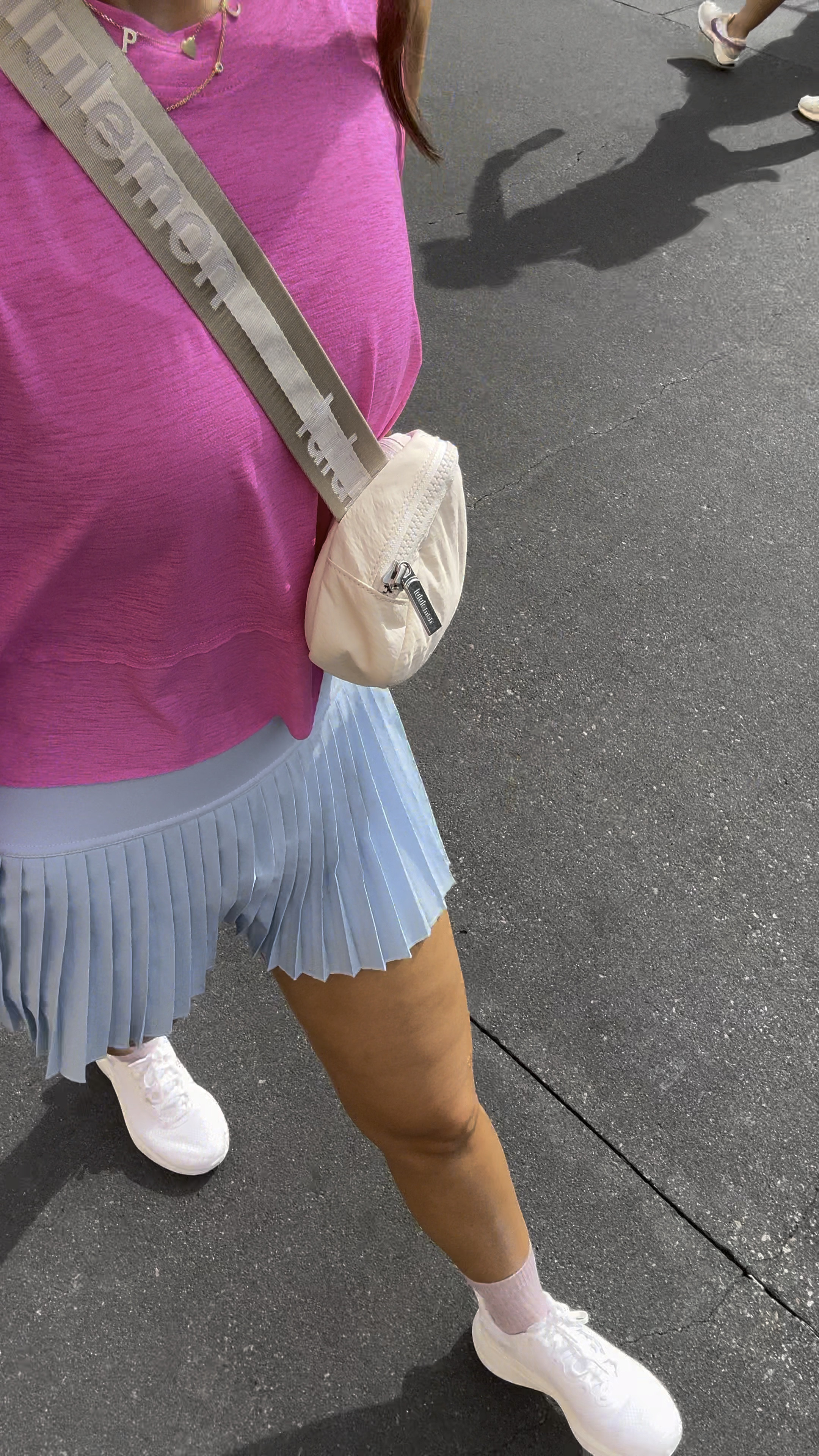 Summer outfit. Baseball mom. Disney outfit - what I wore to Hollywood studios! Free People tempo tank (XS) - SO breezy and perfect for hot temps, linking a similar Amazon style, too! Amazon pleated skirt in XXS. Amazon sports bra in XS. Lululemon chargefeel shoes are TTS and great for walking long distances! White sneakers. Lululemon belt bag. 

#LTKActive #LTKTravel #LTKShoeCrush