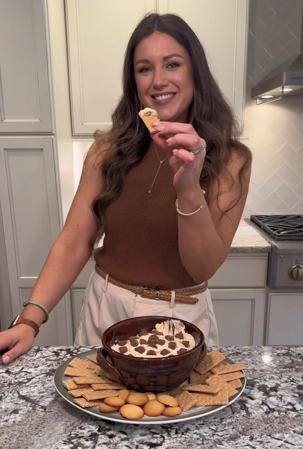 Calling all peanut butter lovers 🥜🤎 this Reese’s peanut butter dip disappeared in minutes and honestly…I get it 😍 Perfect for parties, movie nights, or a late night sweet tooth moment ✨ 

Reese’s Peanut Butter Dip
8 oz cream cheese, softened
1 tsp vanilla extract
3/4 cup creamy peanut butter 
1 cup powdered sugar
8 oz cool whip
7.6 oz bag Reese’s minis, divided

Mix together cream cheese and vanilla with a mixer, add in peanut butter, then add in powdered sugar until smooth. Using a spatula, mix in cool whip. Fold in 1/2 of the chopped Reese’s minis, use the rest to top. Serve with vanilla wafers & graham crackers! Enjoy!

Reese’s dessert dip, peanut butter dessert dip, easy dessert dip recipe, no bake dessert, Reese’s recipes, dessert board ideas, sweet snack recipe, summer dessert ideas, party dessert dip, chocolate peanut butter dessert, easy entertaining recipes, dressy summer outfit, tan shorts outfit, brown sweater tank outfit, neutral outfit inspiration, casual chic outfit, summer dinner outfit, elevated casual look, neutral fashion inspo, summer style ideas

#LTKHome #LTKootd #LTKSeasonal