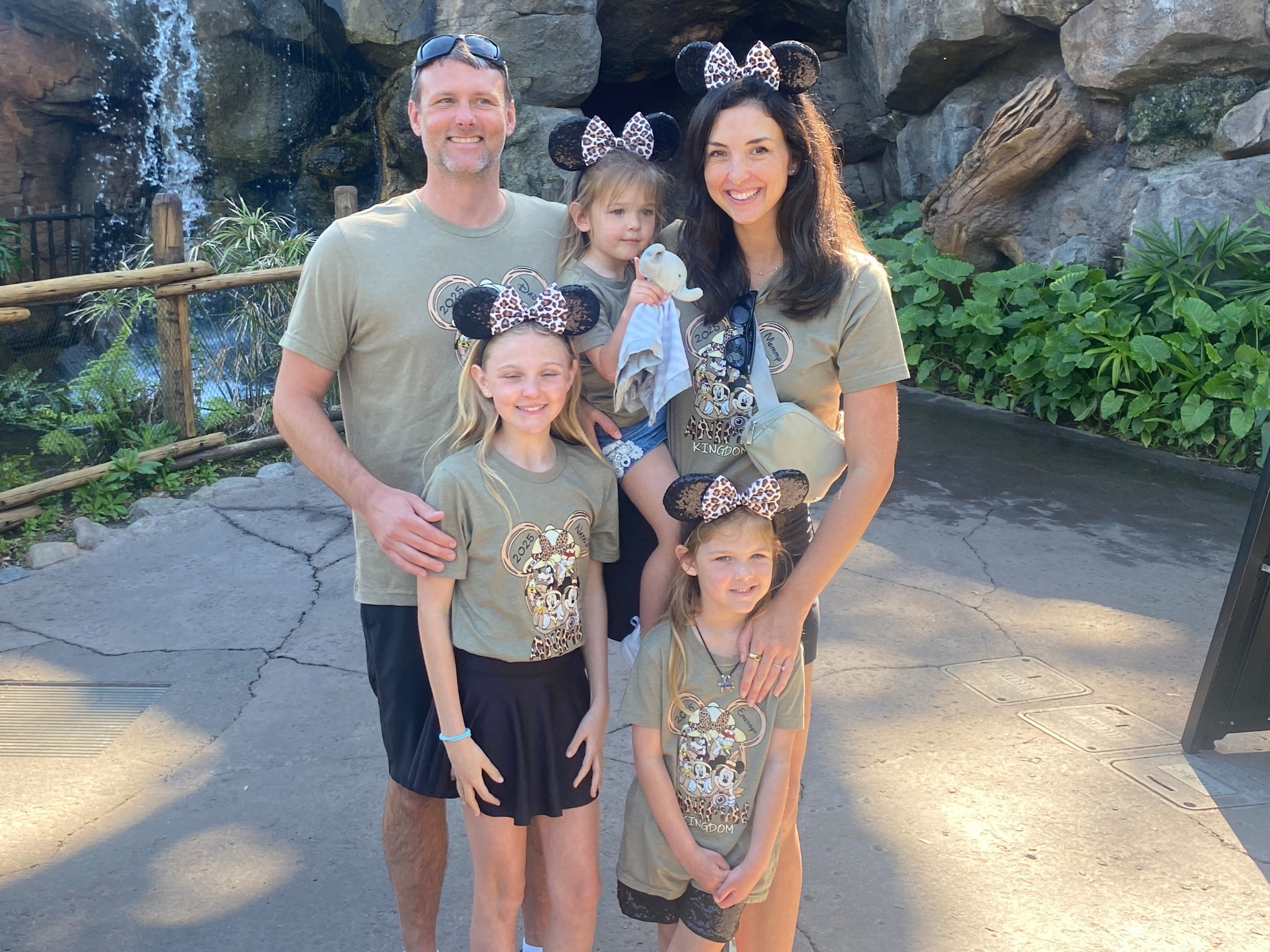 Disney World Animal Kingdom family matching a shirts and animal kingdom leopard Minnie Mouse ears. We’re wearing the color heather olive. Also linked my belt bag (this color isn’t available anymore), sneakers and black tennis skirt. Everything fits true to size. 

#LTKFamily #LTKFindsUnder50 #LTKTravel