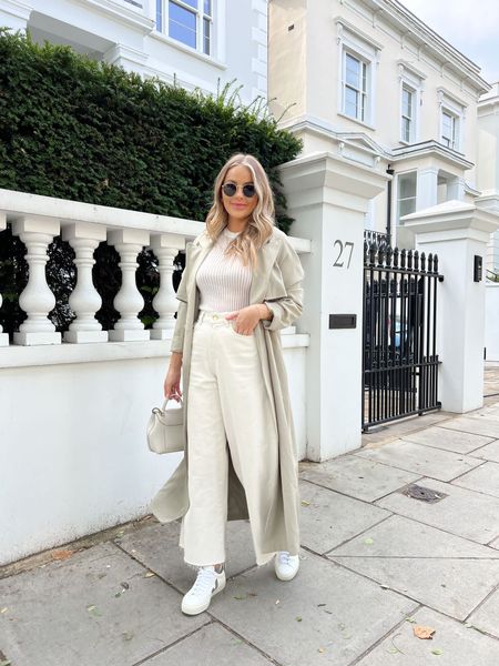 Neutral tones outfit - wide leg cropped white jeans, Veja trainers, cream bag, knit white top, trench coat & rayban sunnies  

#LTKSeasonal #LTKeurope #LTKstyletip