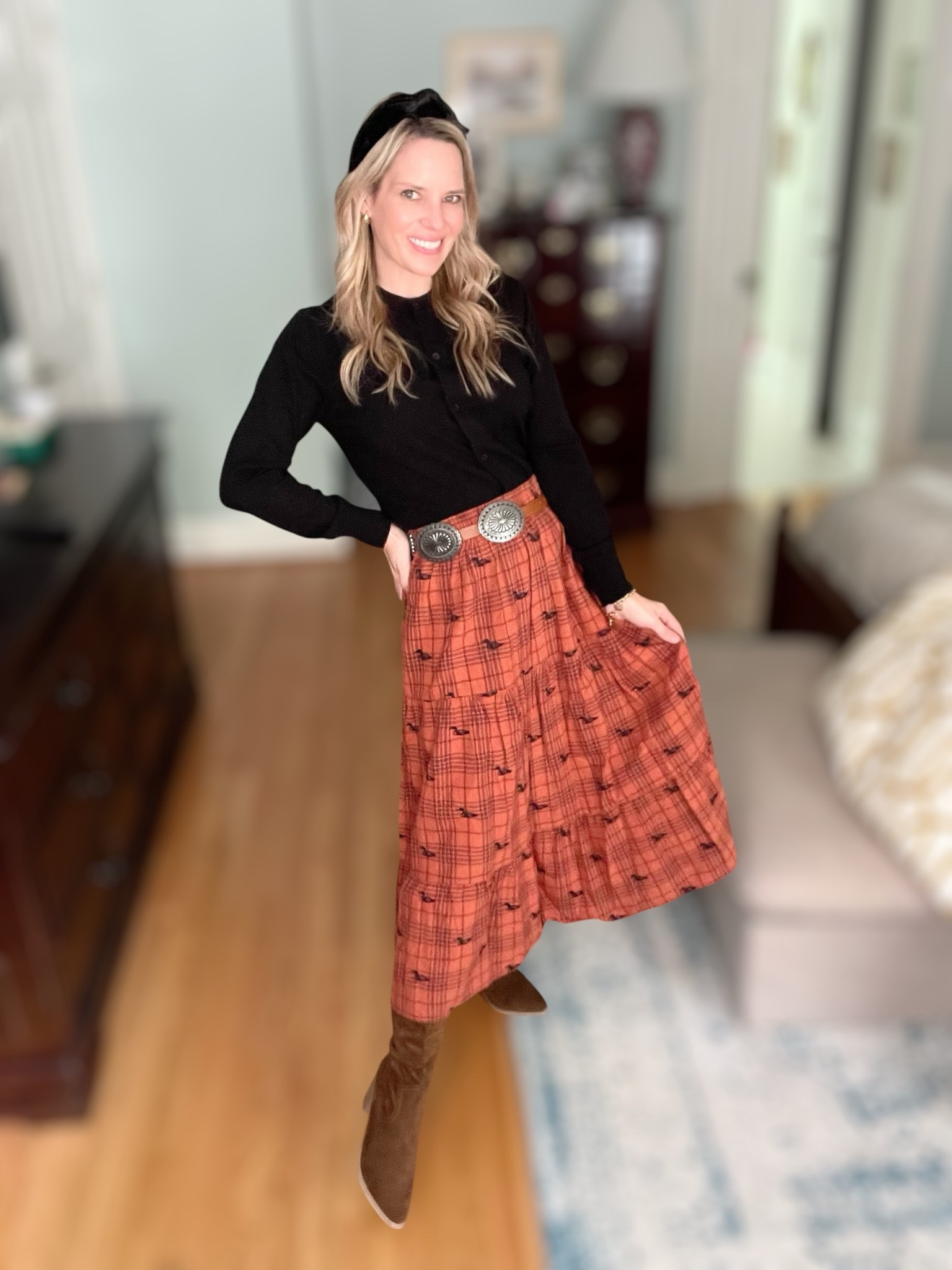 Fall styling made easy 🍂✨ I paired a classic black knit top with a rust plaid pleated midi skirt for the perfect autumn look. A western concho belt cinches the waist for a flattering touch, while suede knee-high boots elongate the legs and add a chic seasonal vibe. The black velvet knotted headband ties it all together with a polished finish, and gold statement earrings bring just the right pop of shine. 🍁 This outfit transitions effortlessly from work to weekend and is perfect for fall gatherings, Thanksgiving, or casual nights out.

⸻

fall outfit inspo, plaid midi skirt, black knit top, suede knee high boots, western concho belt, velvet knotted headband, gold hoop earrings, Thanksgiving outfit, fall capsule wardrobe, autumn style, LTK fall fashion, chic fall outfit ideas


#LTKShoeCrush #LTKFindsUnder100 #LTKFindsUnder50