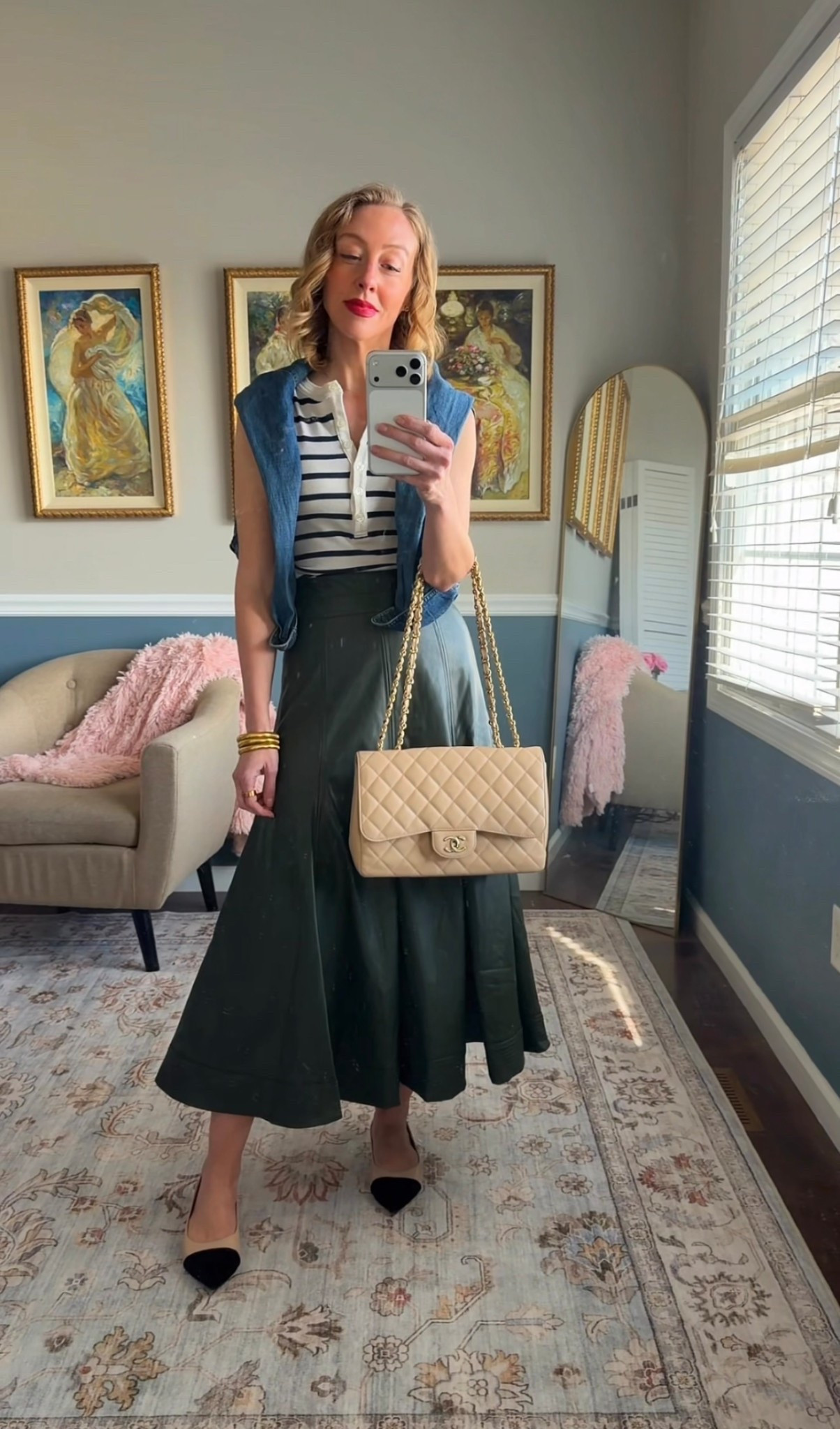 Striped knit top, structured green midi skirt, denim shirt draped over shoulders, black cap-toe heels, beige quilted shoulder bag.

Classic heritage-inspired spring outfit.

Timeless American style.

#LTKSeasonal #LTKootd #LTKOver40
