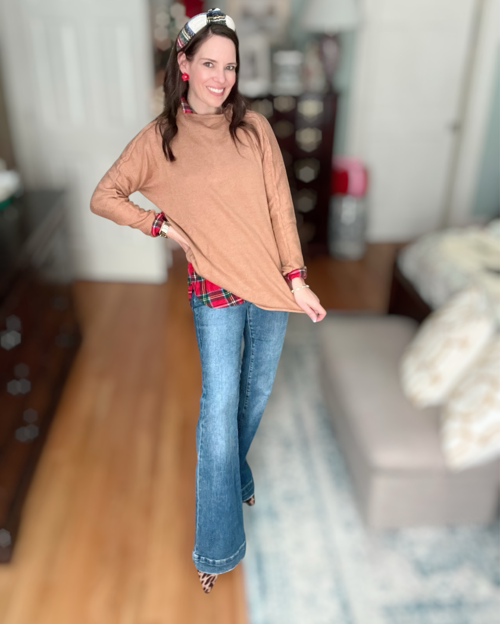 This is what I call cozy holiday cute 🎁 Layering a classic red plaid button-down under this soft camel sweater gives the outfit instant warmth + texture without feeling bulky. It’s the easiest trick ever for looking styled with zero effort.

Paired it with my favorite kick flare/bootcut denim so the outfit still feels relaxed and everyday wearable 💕 And then I topped it with the tartan padded headband for that subtle holiday nod 🎄✨

The earrings are the sweetest little pop of red — they bring the whole outfit to life in such a cheerful, festive way without overpowering anything. It’s just enough color + personality to feel fun 🎀

This look is perfect for school drop-off, cookie decorating, gift shopping, Christmas movies on the couch, holiday errands, teacher events, or just living your cozy December life. It’s festive — but not “try hard,” which is exactly what I love about it 🤎

Feel-good, warm, easy, and super wearable. My December uniform.

⸻

holiday outfit casual christmas outfit cozy winter outfit plaid shirt layered outfit camel sweater outfit festive everyday style tartan headband preppy winter style classic holiday colors comfortable mom outfit merry & bright december looks 🎄✨

#LTKFindsUnder50 #LTKHoliday #LTKFindsUnder100