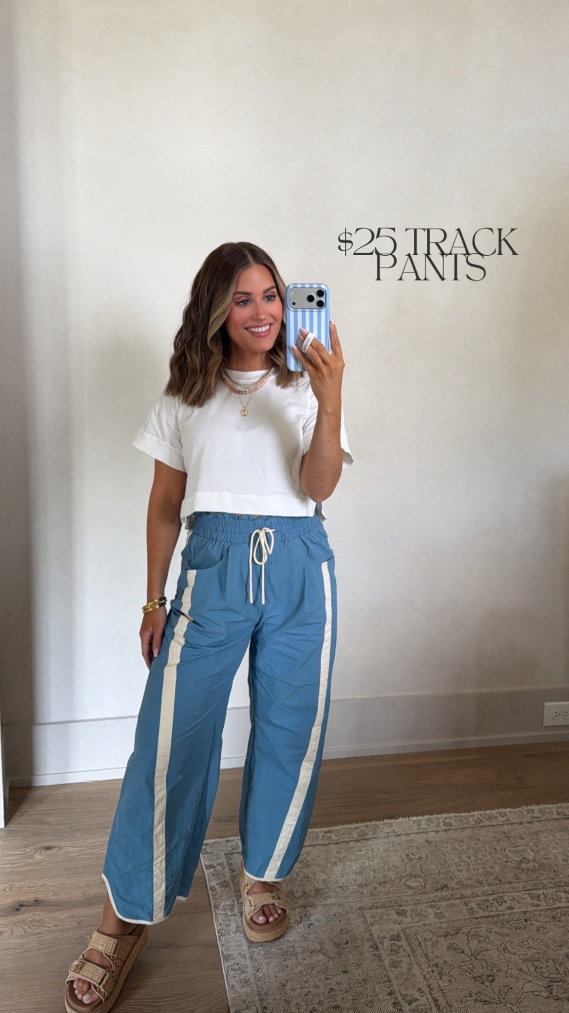 Wearing a small in these $25 track pants — come in lots of colors! Paired with an old white tee, but will link similar. Sandals run tts! 

*currently 17 weeks pregnant 

Casual style, track pants, barrel pants, bump friendly, white tee 

#LTKBump #LTKSaleAlert #LTKootd