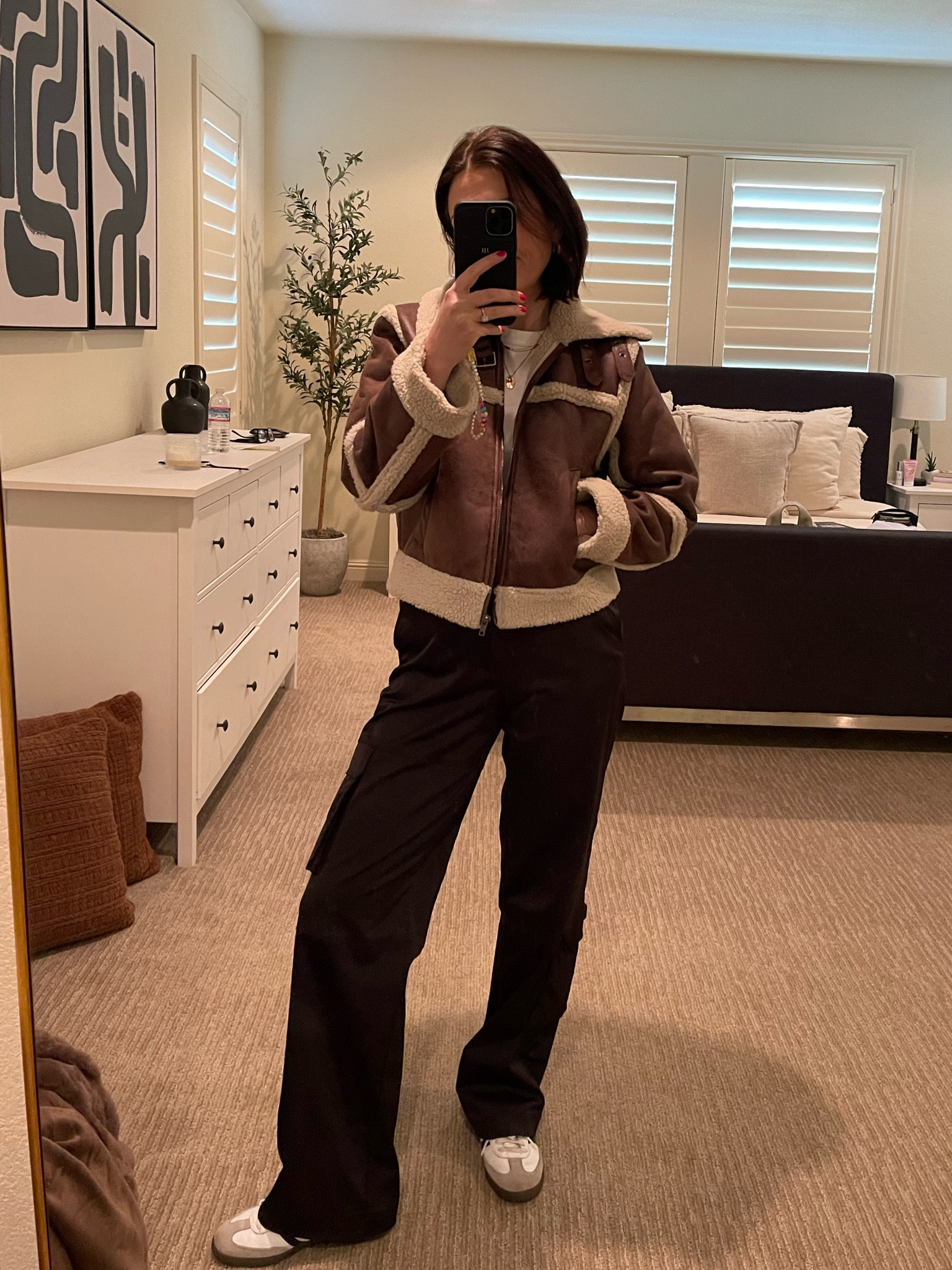 Winter outfit idea 
Classic white tee - Uniqlo 
Teddy jacket 
Black cargo pants 
Adidas sambas 

#LTKshoecrush #LTKstyletip #LTKSeasonal