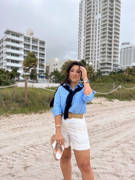 Blue and white vacation outfit inspo. Striped button down shirt. Linen blend shorts. Navy pullover sweater. Jack Rogers sandals. 

#LTKSeasonal #LTKtravel #LTKstyletip