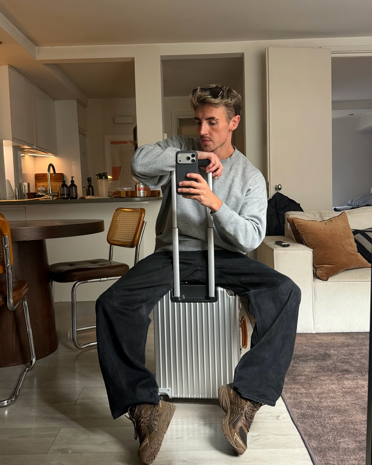 Travel outfit with brown trainers black jeans and a grey sweatshirt

#LTKMens #LTKTravel #LTKdayinmylife