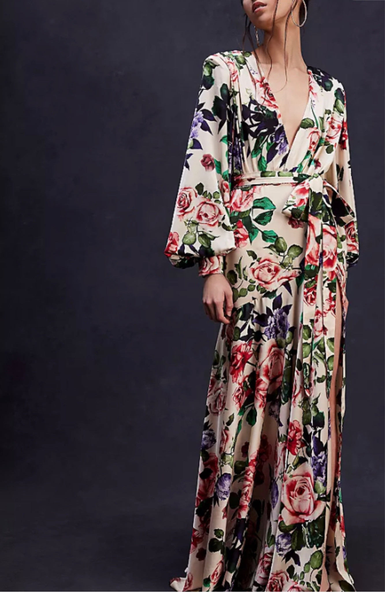 Turn heads in this timeless gown featured in a floral-printed design with wrap-front closure, exaggerated side slit, asymmetric dropped waist, and defined sleeves for added shape.

#LTKMostLoved
