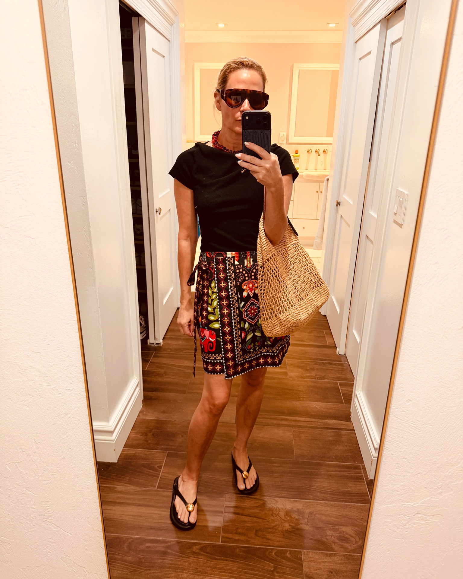 This skirt is under $20 from Amazon! I love how easy it is to style - a great throw and go summer piece. I ordered it in green print and black print. The necklace is also from Amazon and less than $20.
Raffia tote bag is currently sold
Out on mango US site so tagged so similar totes below.

#LTKsummer #LTKbag #LTKstyletip